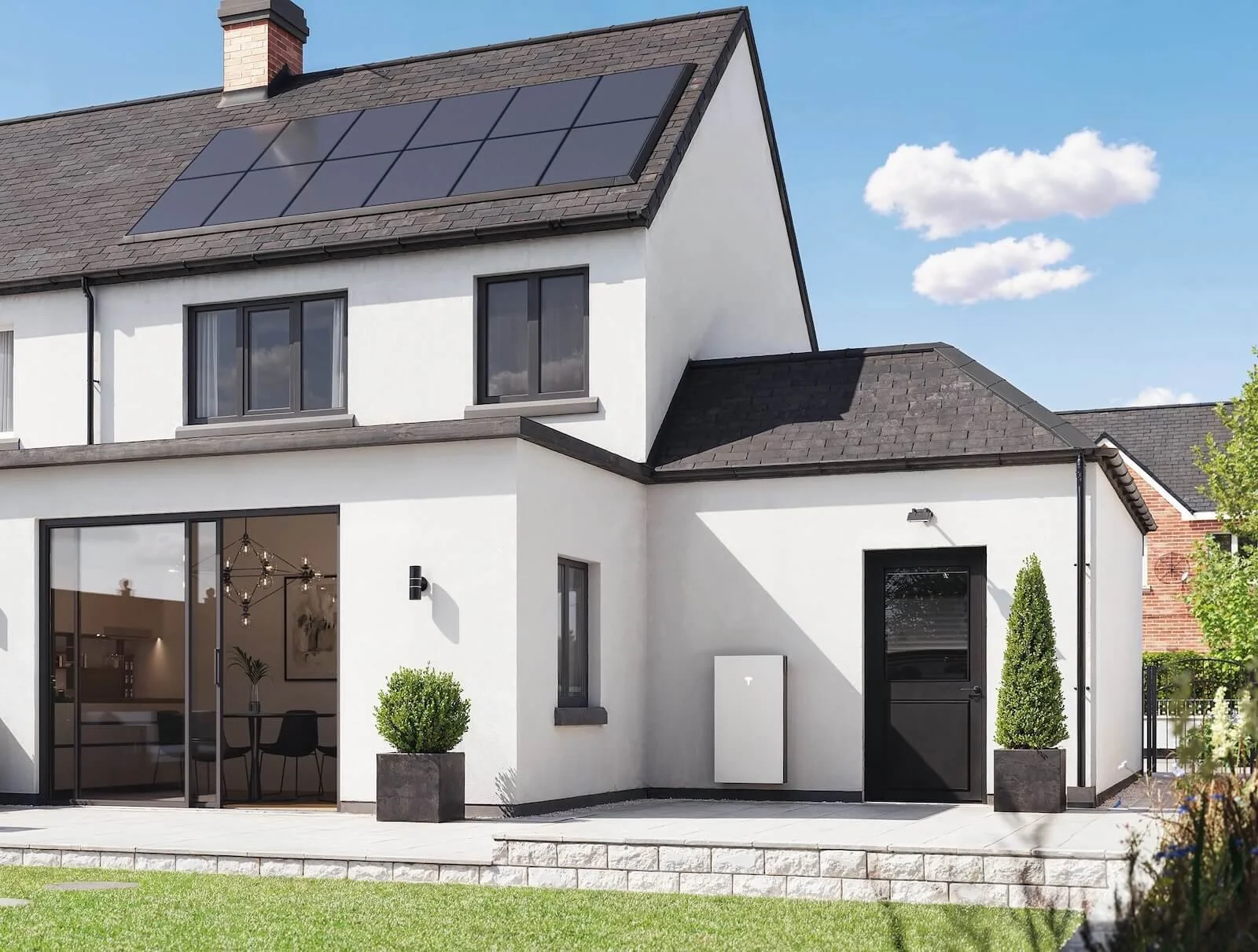 Completed home solar installation with roof panels and battery storage