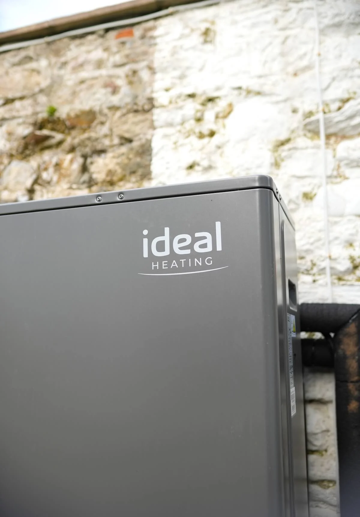 Ideal Logic HP290 air source heat pump installed outside a South West home