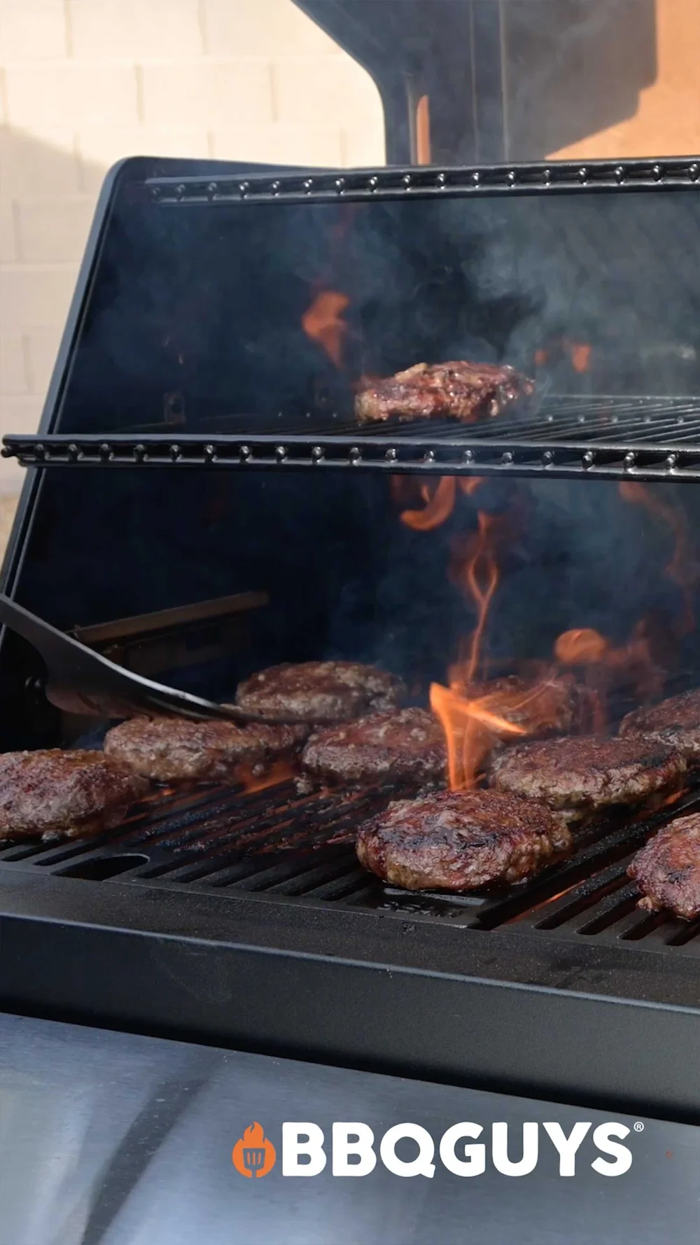 Masterbuilt Gravity Series grill cooking steaks during a BBQGuys product review video