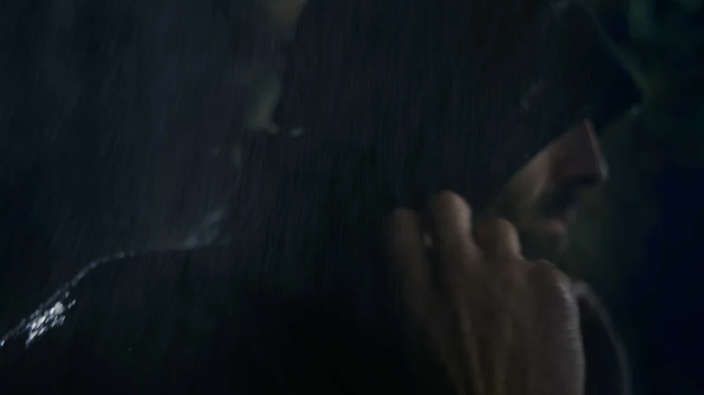 Outdoor lifestyle commercial video still highlighting weather protection features of Nor’easter jacket