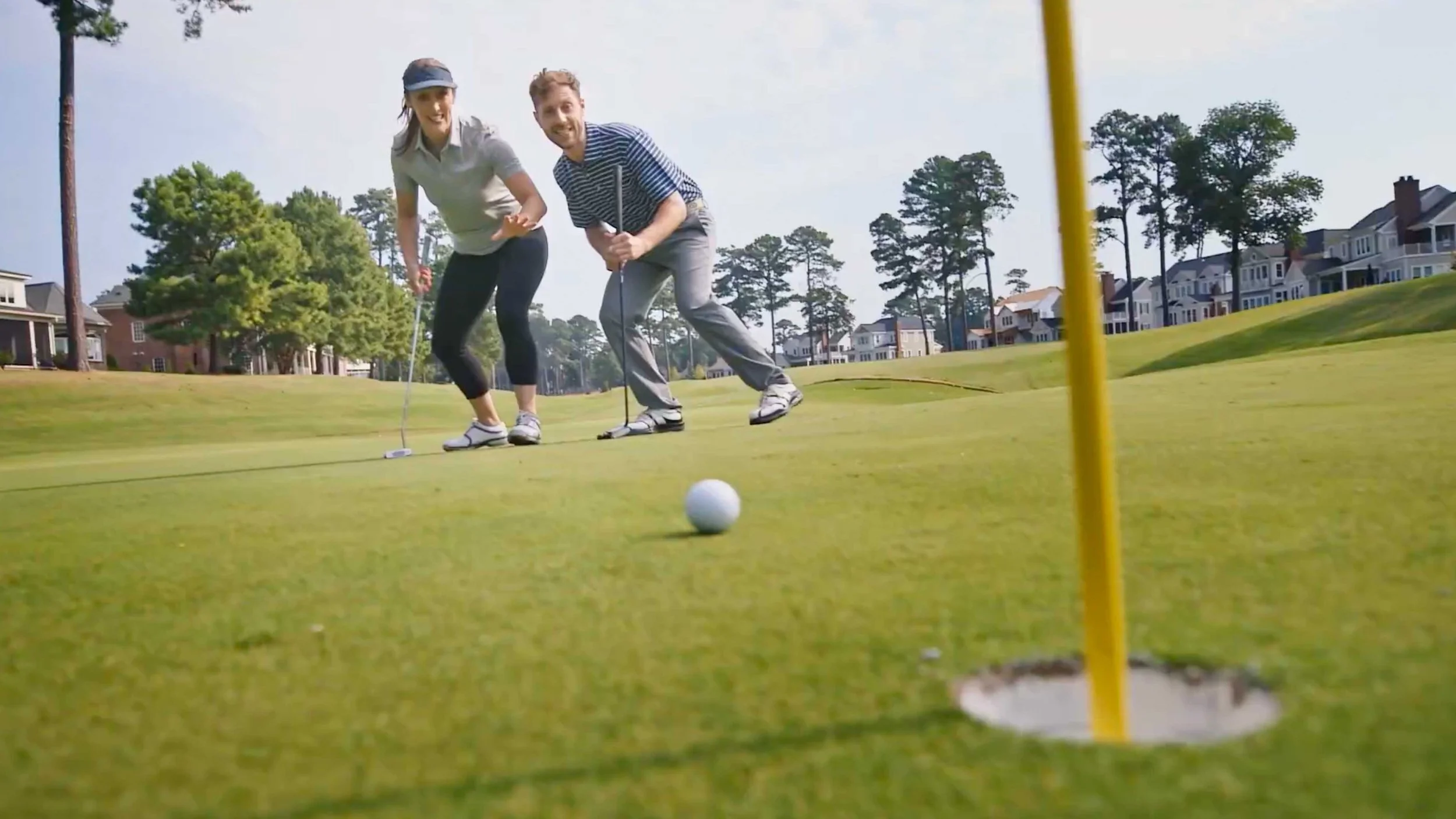 A couple golfing in a travel and tourism video ad for Williamsburg, VA