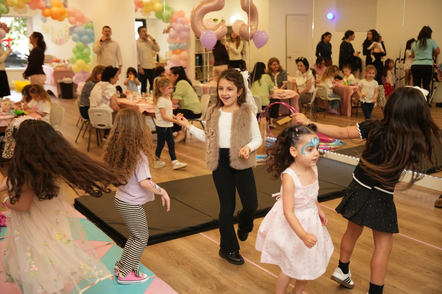 Kids dancing together at a birthday party at Danzone Studios
