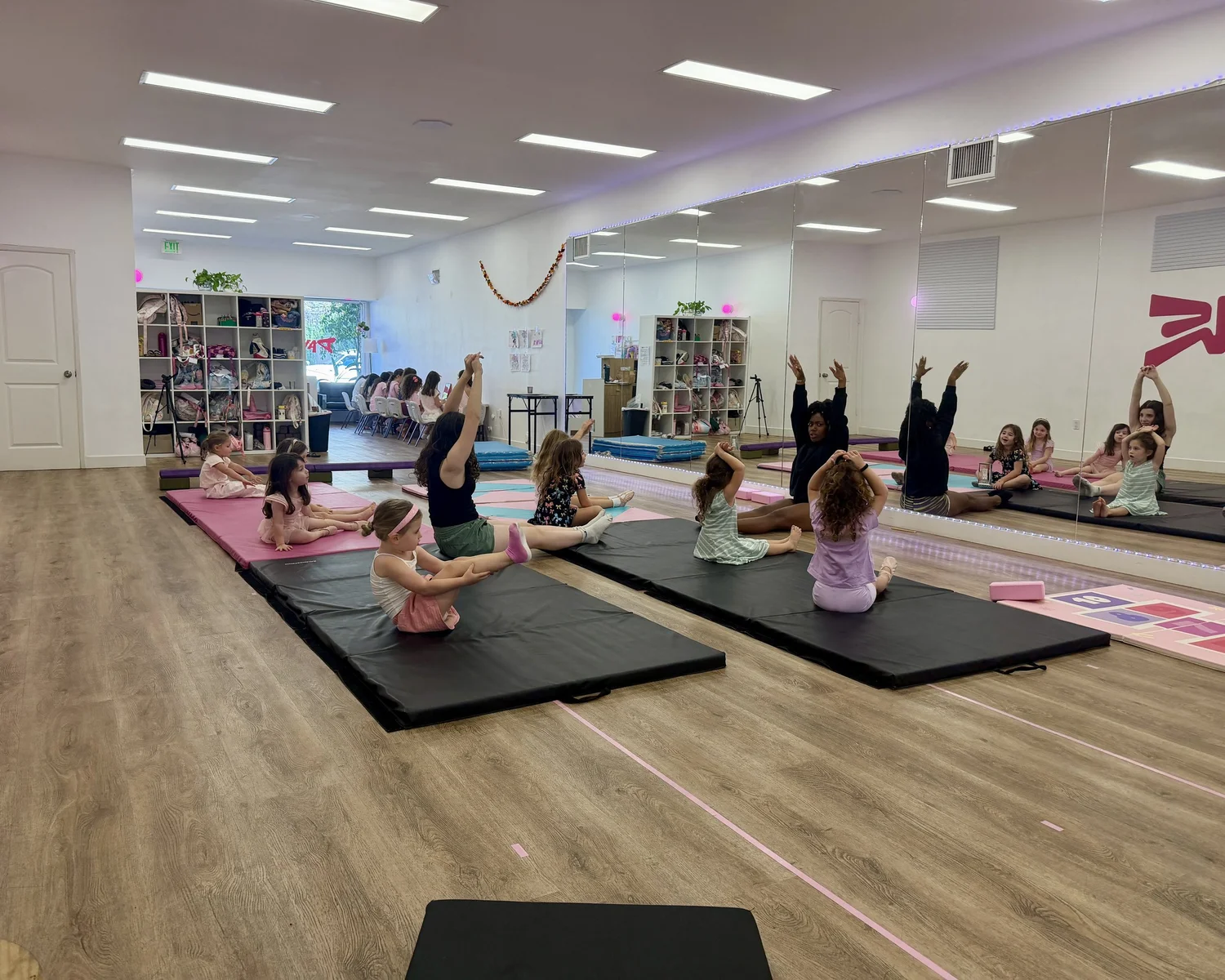 Campers stretching on mats in the Danzone studio