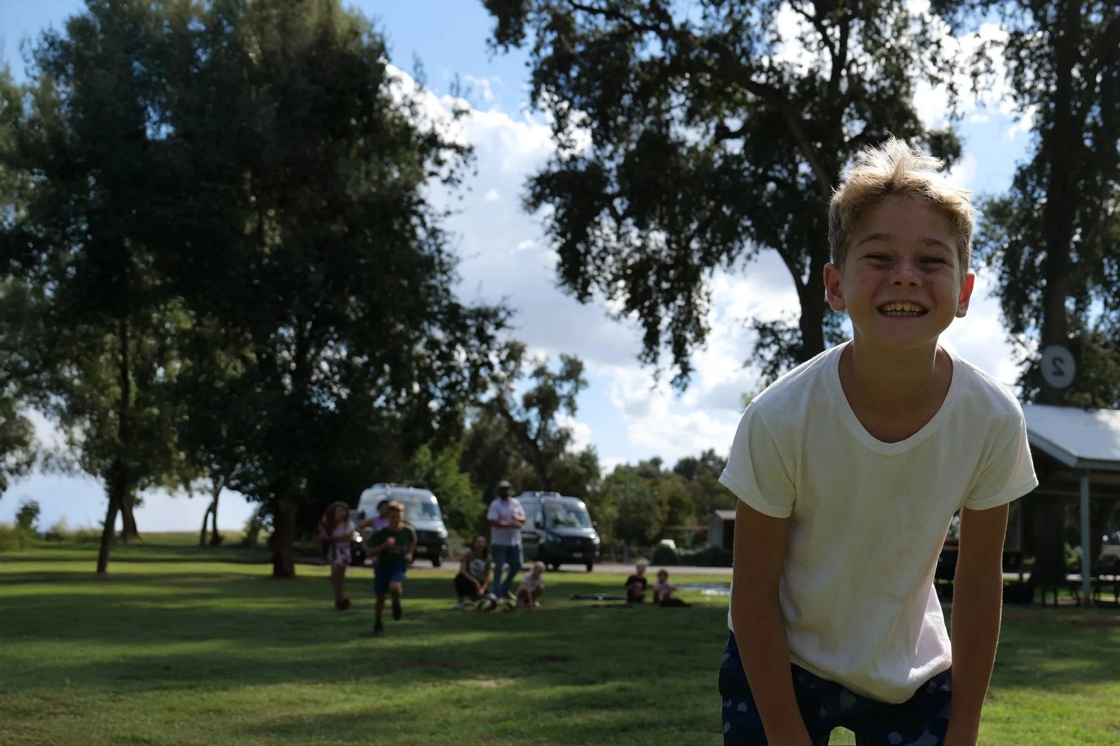 A smiling child at the park with Fit Visalia