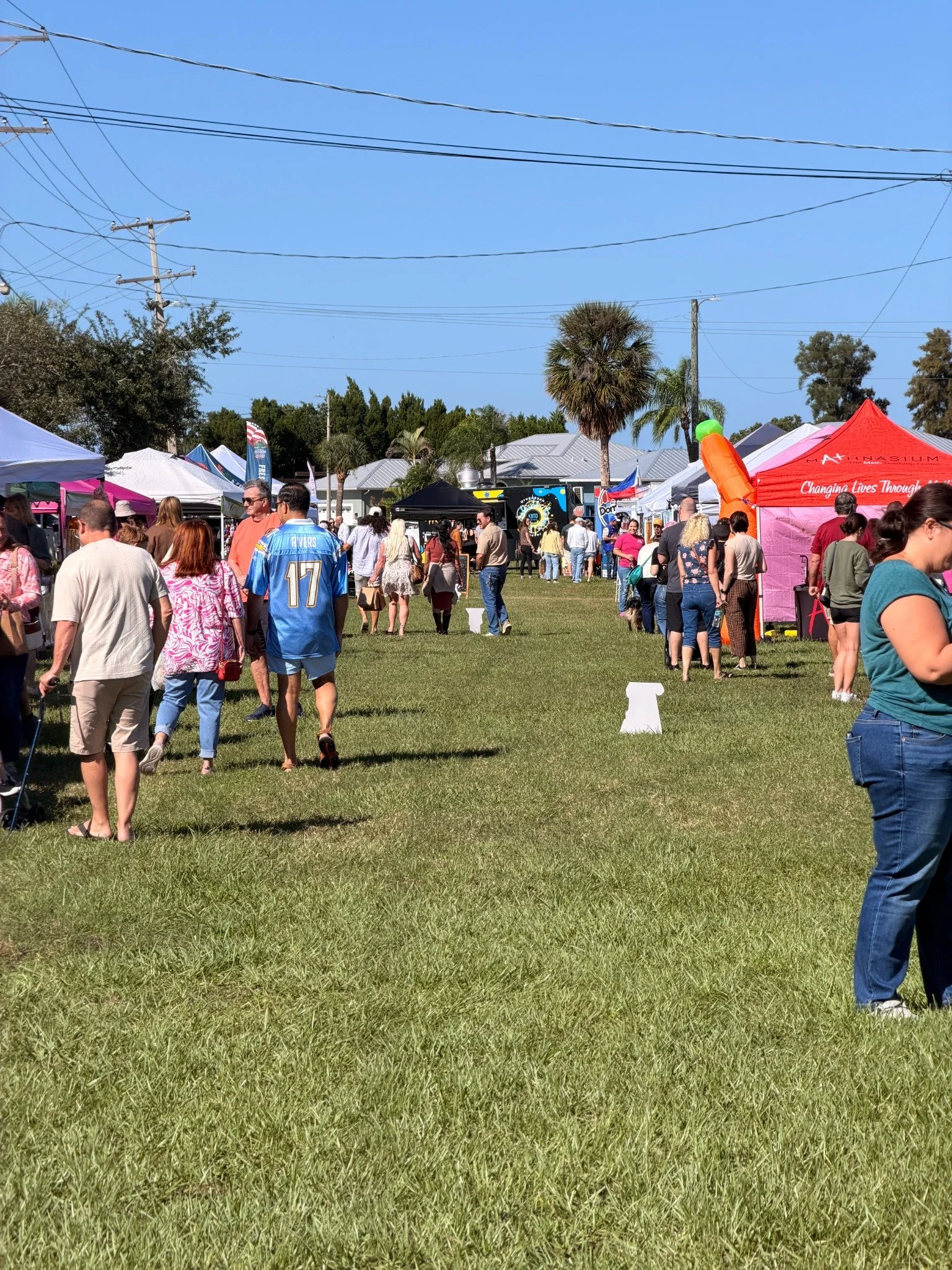 A busy morning among Apollo Beach Market vendor tents