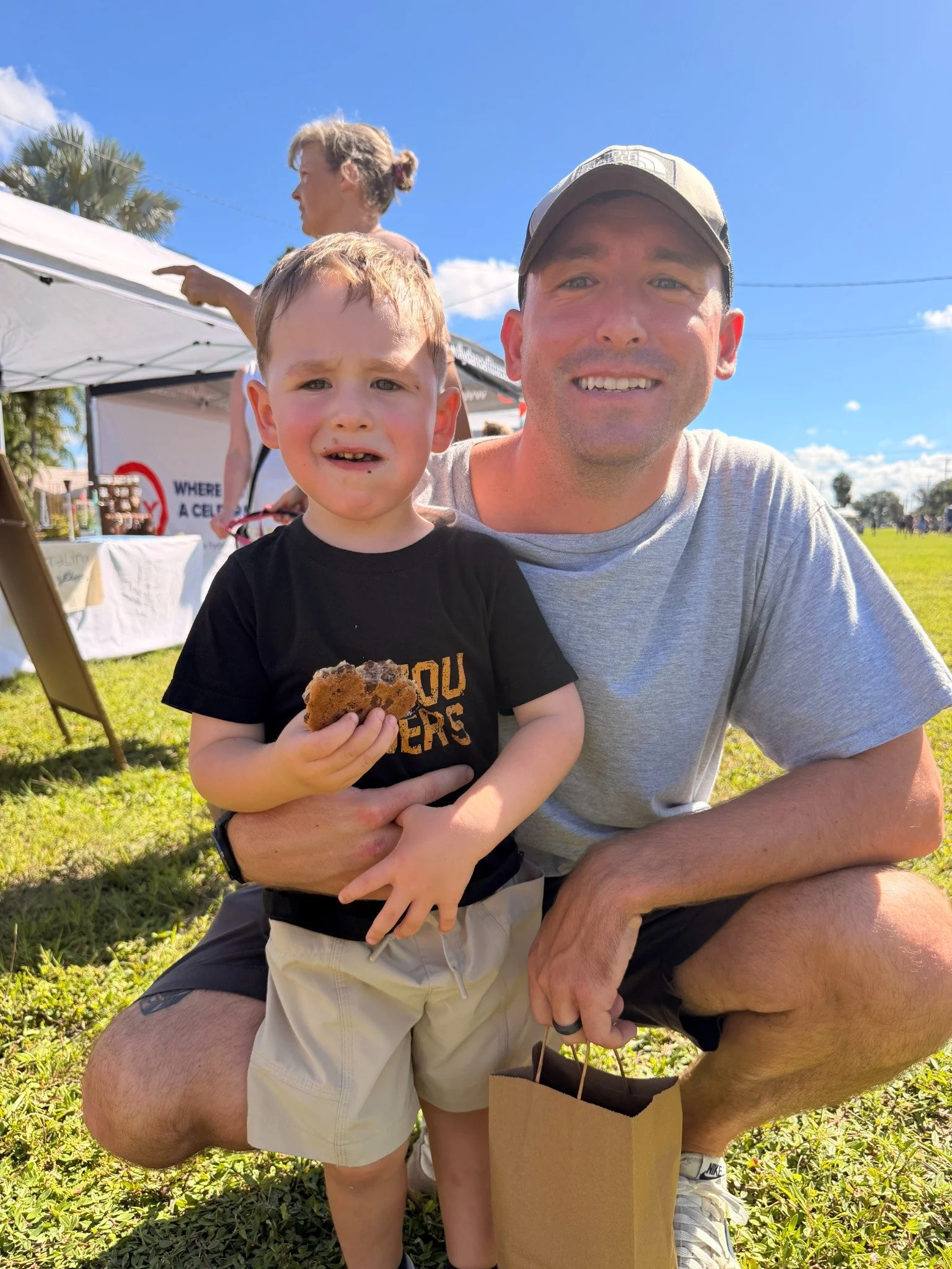 An adult and child enjoying a day at Apollo Beach Market