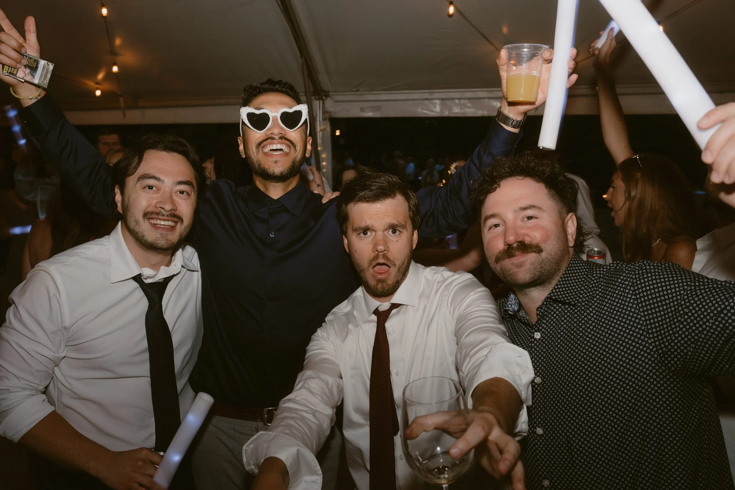 Wedding guests celebrating together on the dance floor