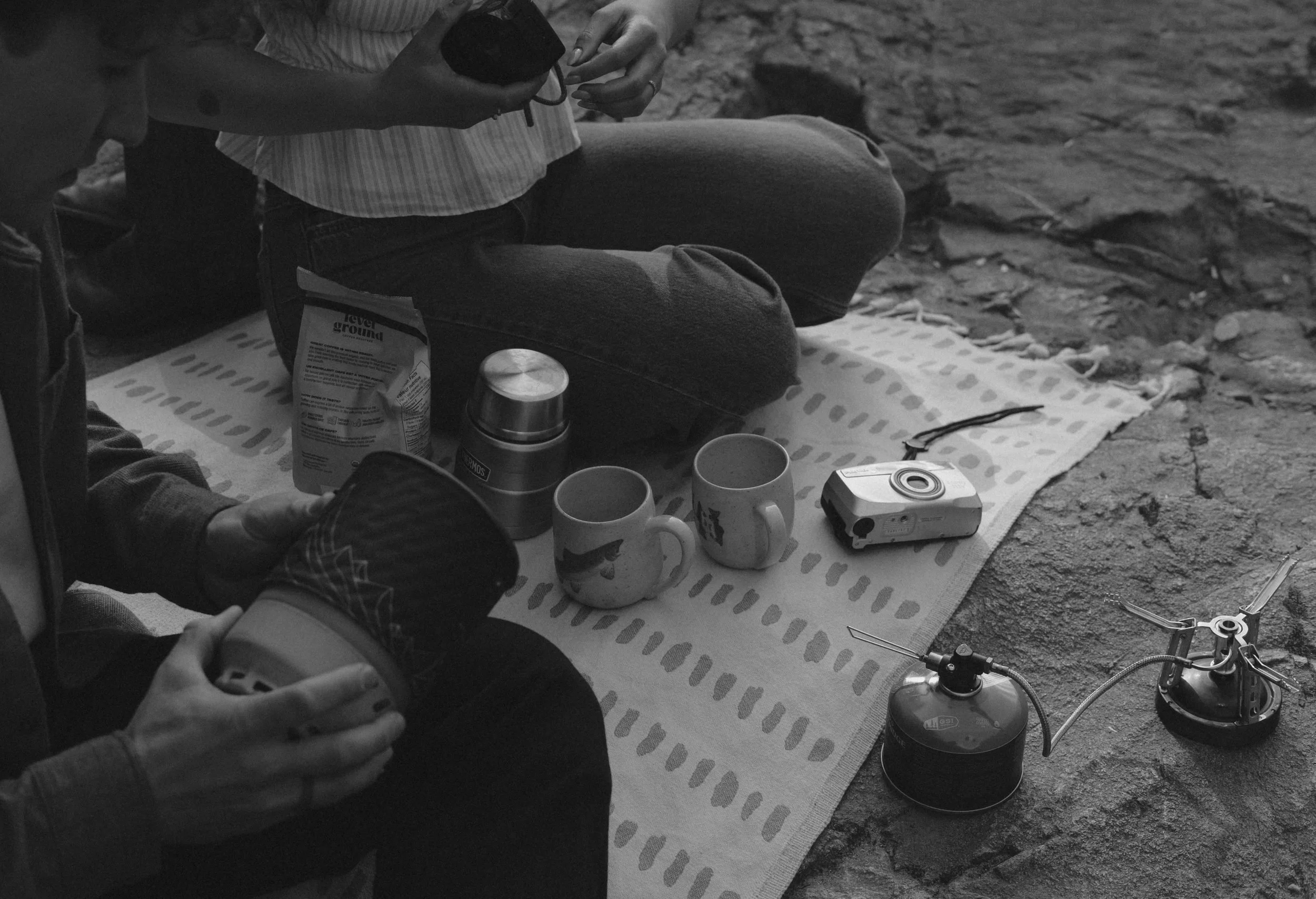 Couple sharing coffee during a picnic at Golden Ears