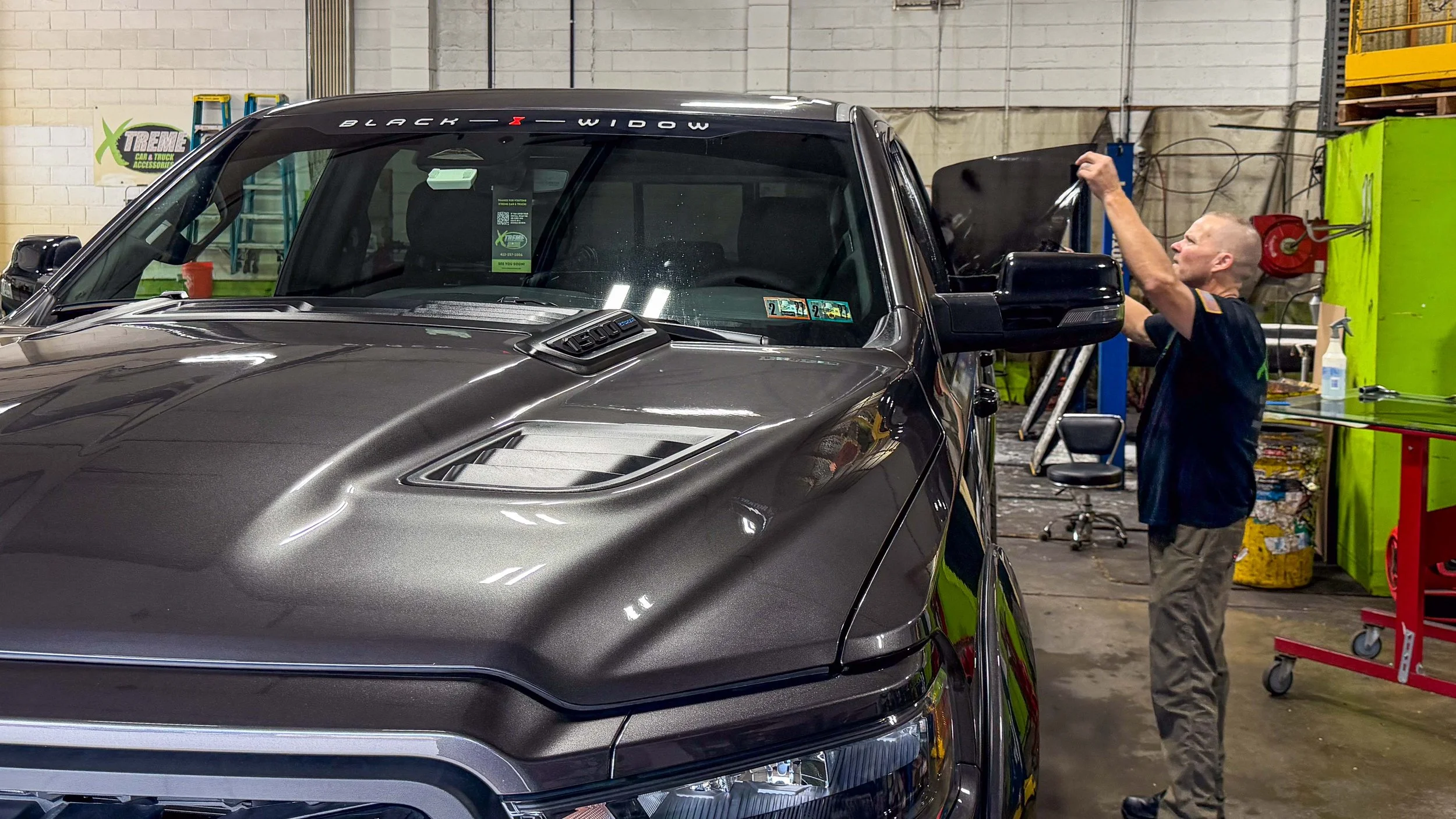 Professional XPEL window tint installation on a lifted pickup truck at Xtreme Car and Truck Accessories in Bridgeville PA near Pittsburgh