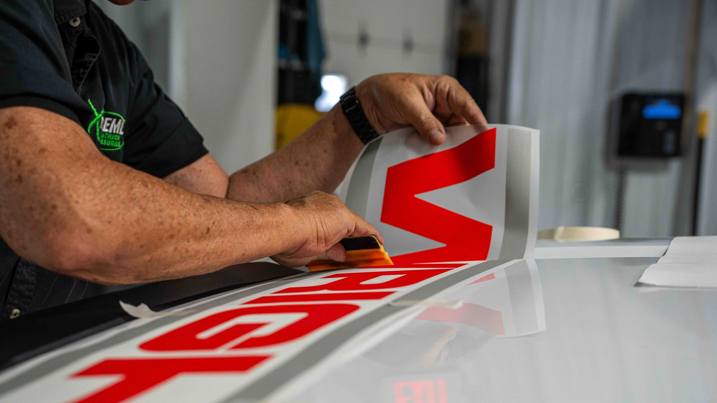 Vinyl decal installation on a W.D. Wright commercial work truck showing professional fleet graphics application at Xtreme in Bridgeville PA