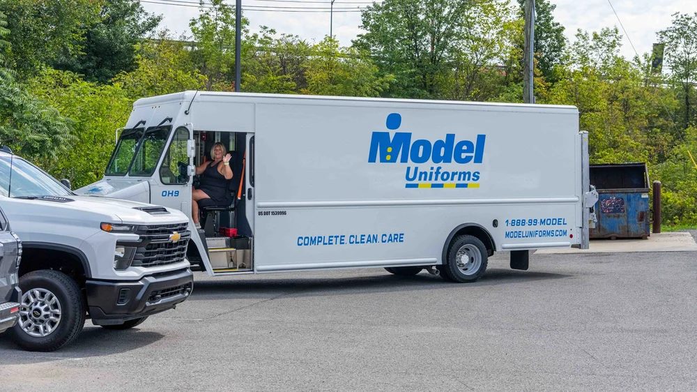 Model Uniforms rental delivery van showing custom vehicle graphics and commercial van lettering installed by Xtreme Car & Truck Accessories near Pittsburgh.