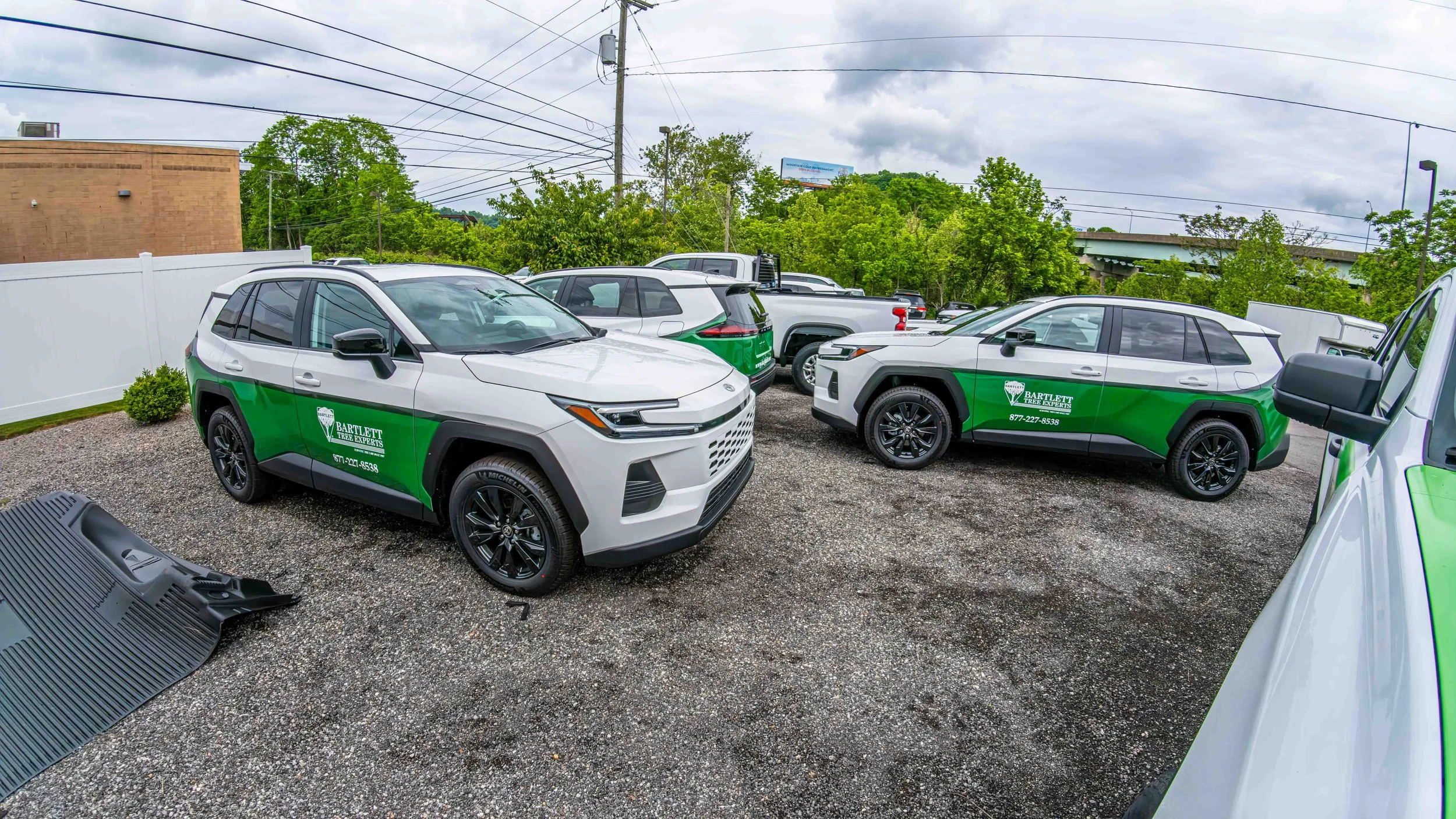Custom vinyl graphics on a fleet of 2026 Toyota RAV4 SUVs completed by Xtreme Car and Truck Accessories in Bridgeville PA