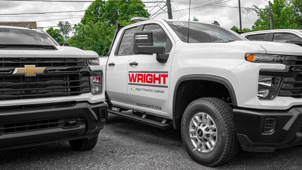 Commercial work trucks with custom W.D. Wright fleet graphics and truck door lettering installed by Xtreme Car and Truck Accessories in Bridgeville PA