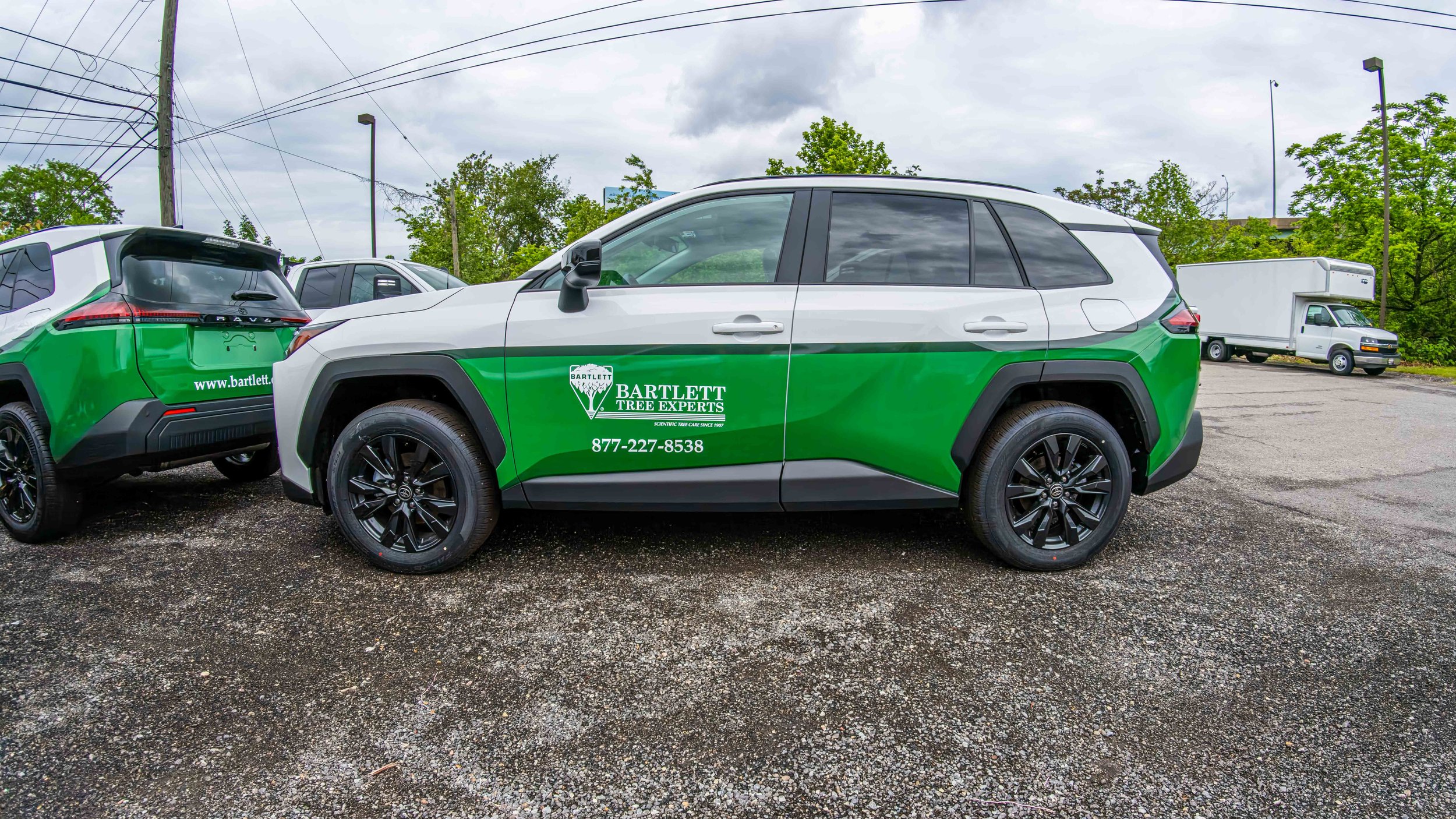 Green and white fleet graphics installed on 2026 Toyota RAV4 SUVs by Xtreme Car and Truck Accessories in the Pittsburgh area