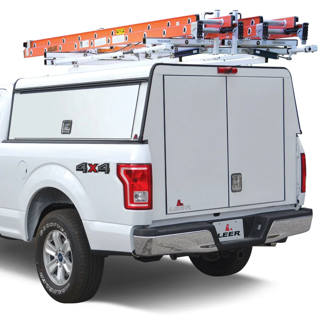 LEER DCC commercial truck cap with side access doors and ladder rack installed on a white Ford F-150, available from Xtreme Car & Truck Accessories in Bridgeville, PA.