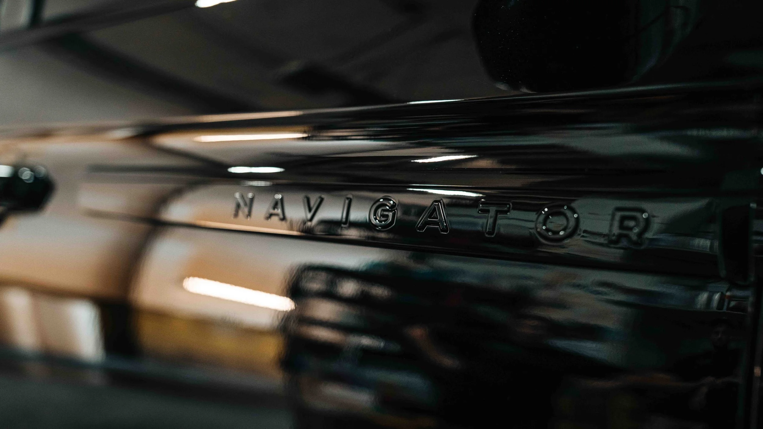 Mirror-gloss black paint on a 2026 Lincoln Navigator after professional detailing and ceramic coating at Xtreme in Bridgeville, PA