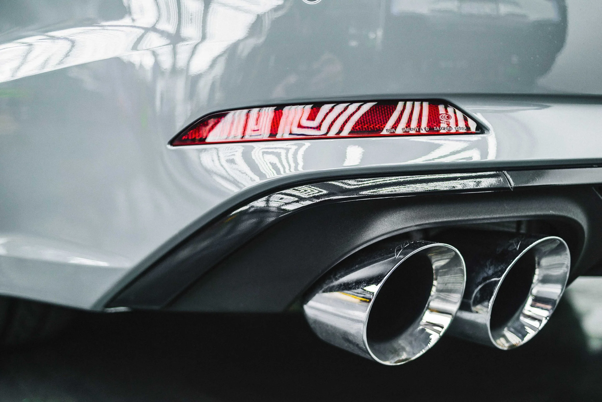 Polished dual performance exhaust tips on a vehicle, showcasing aftermarket exhaust upgrades from Xtreme Car & Truck in Bridgeville, PA