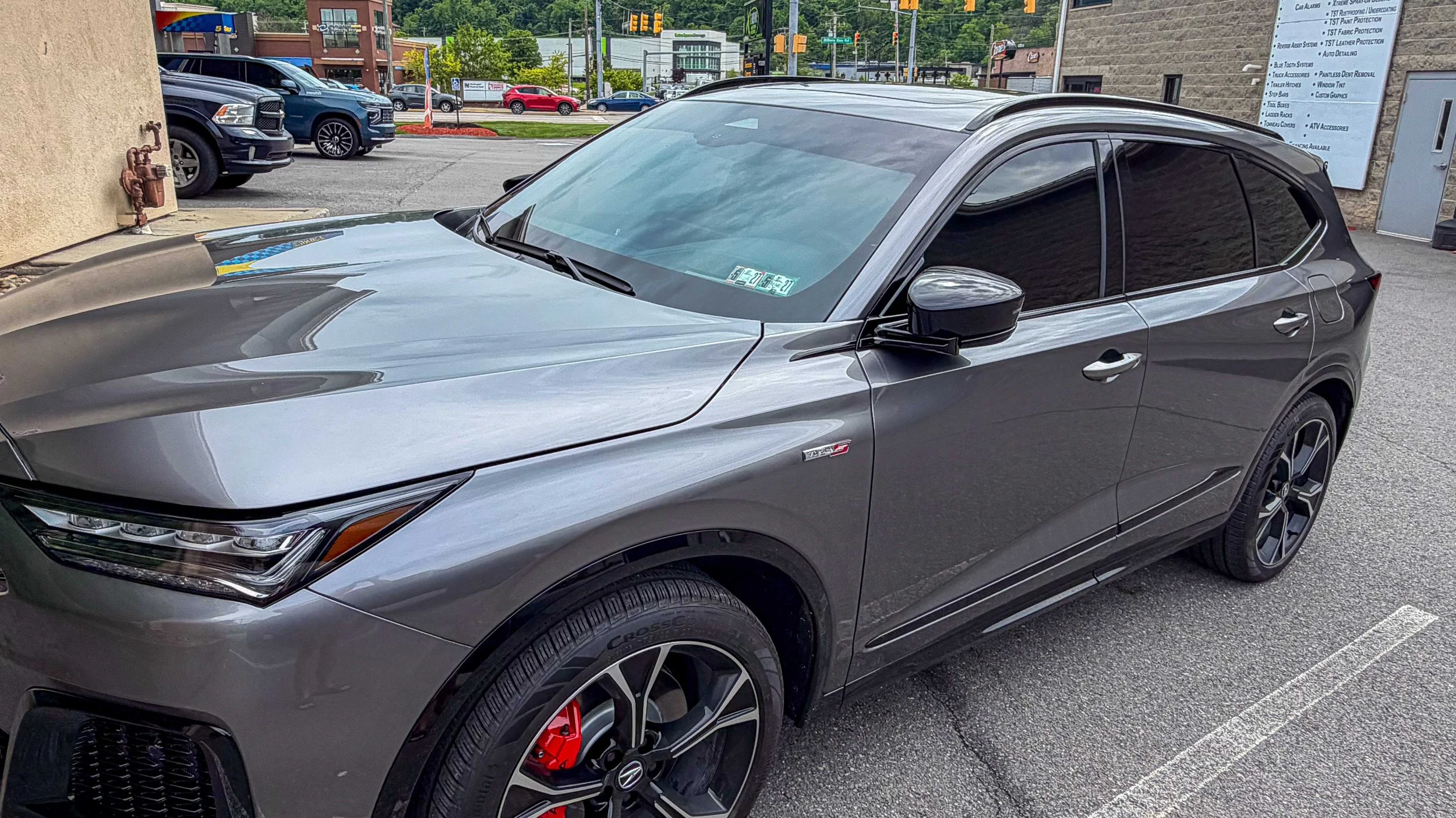 Front-side view of a gray Acura SUV with XPEL window tint from Xtreme Car and Truck Accessories in Bridgeville PA, serving Pittsburgh drivers