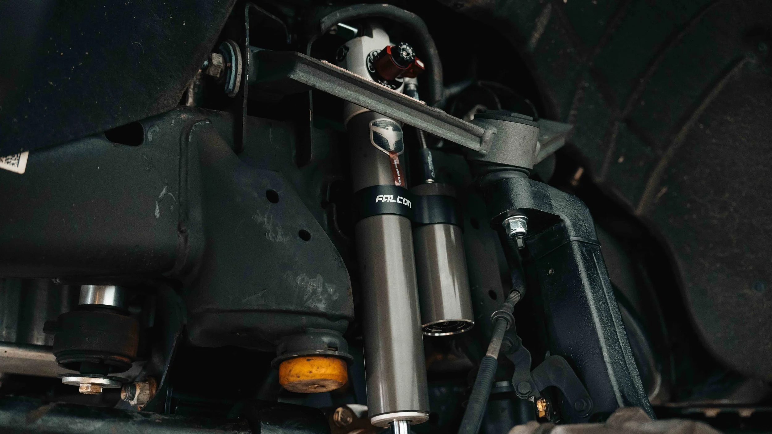 Falcon 3.3 shock and ReadyLIFT upper control arm installed on a GMC Sierra 6-inch MAX3 suspension lift.