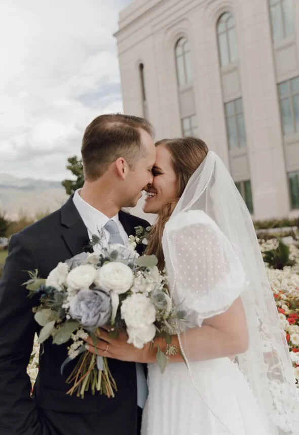 tanned woman standing outside a van