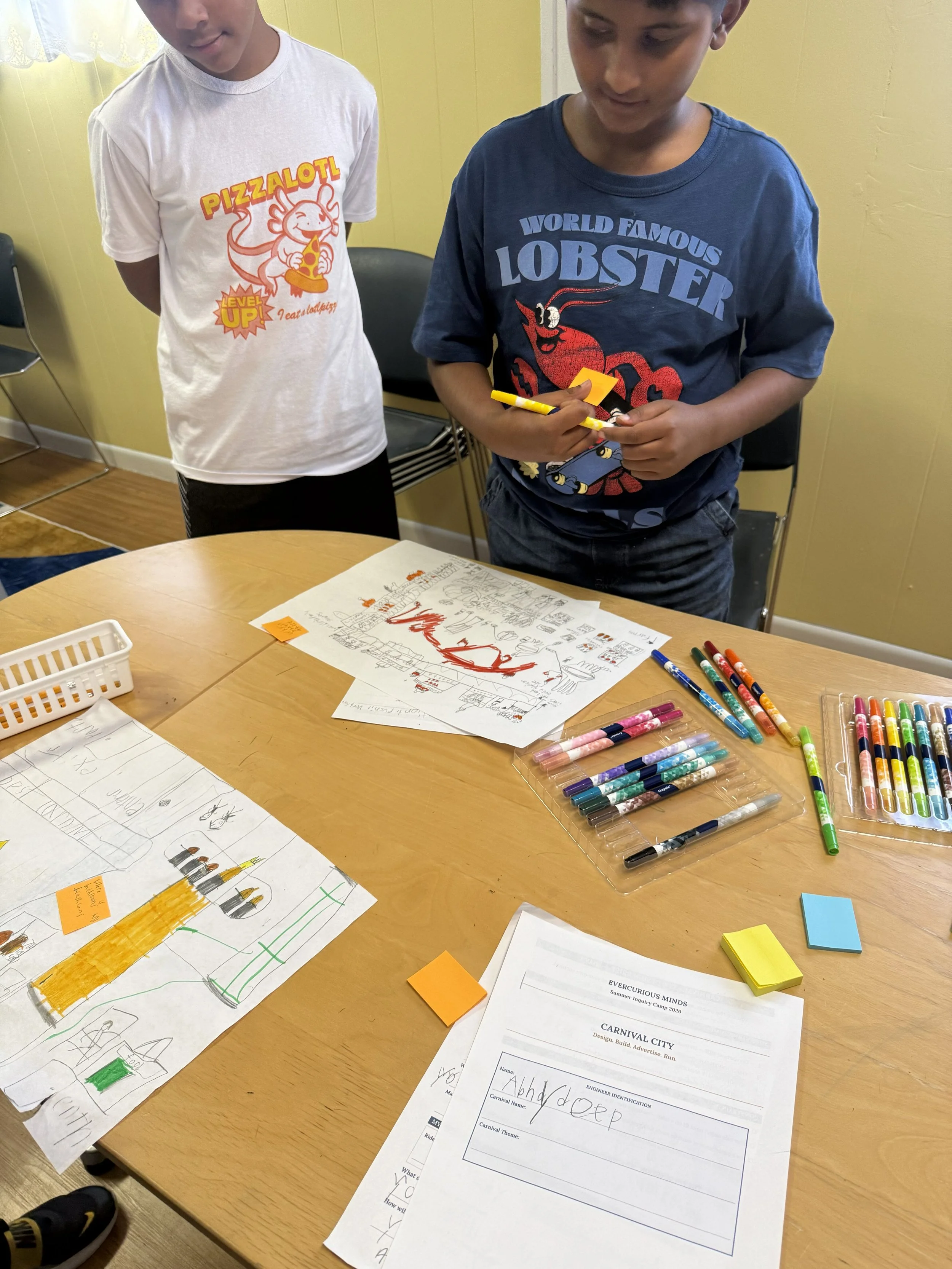 Students working around a table with learning materials