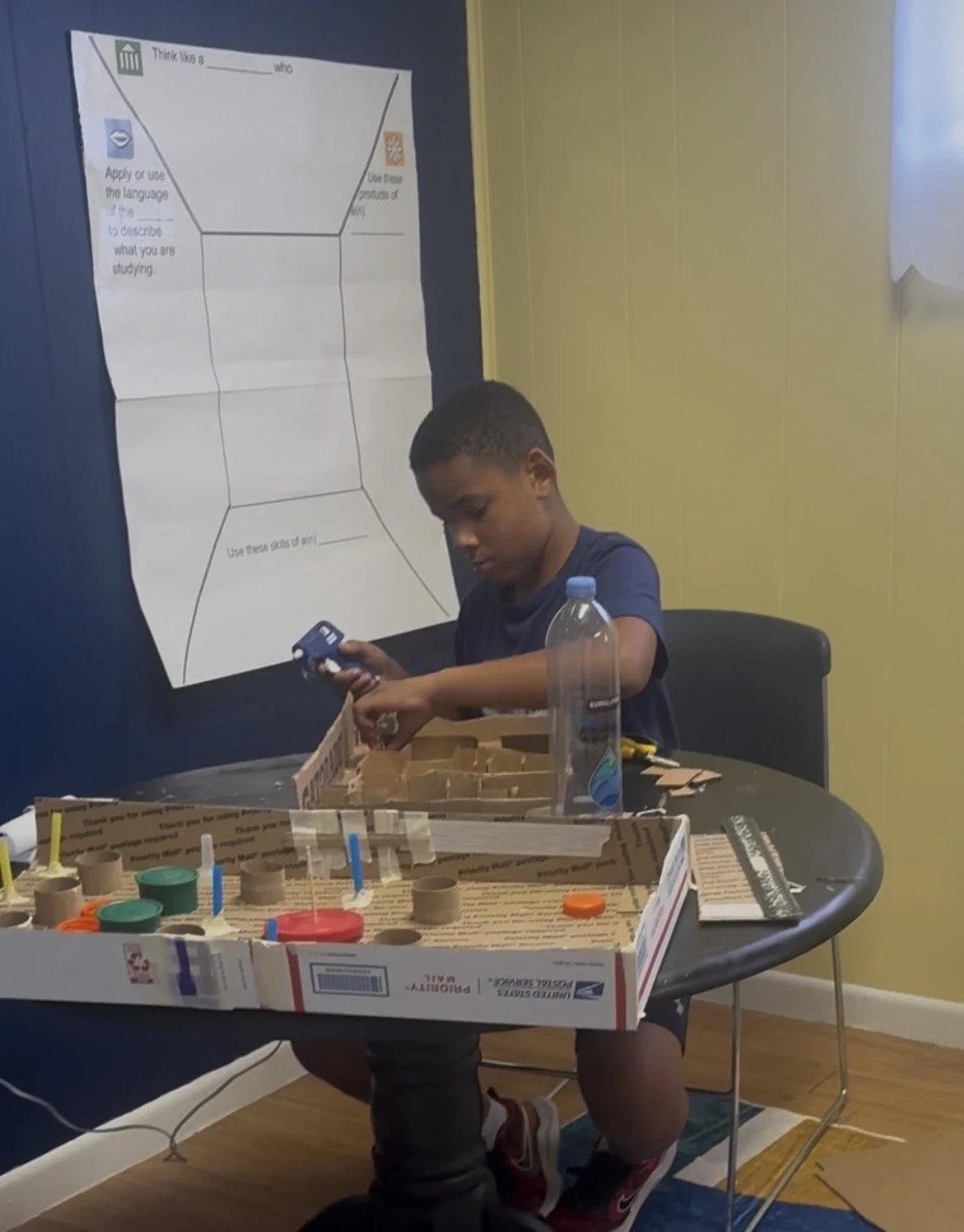 Student creating a carnival game during a discovery activity