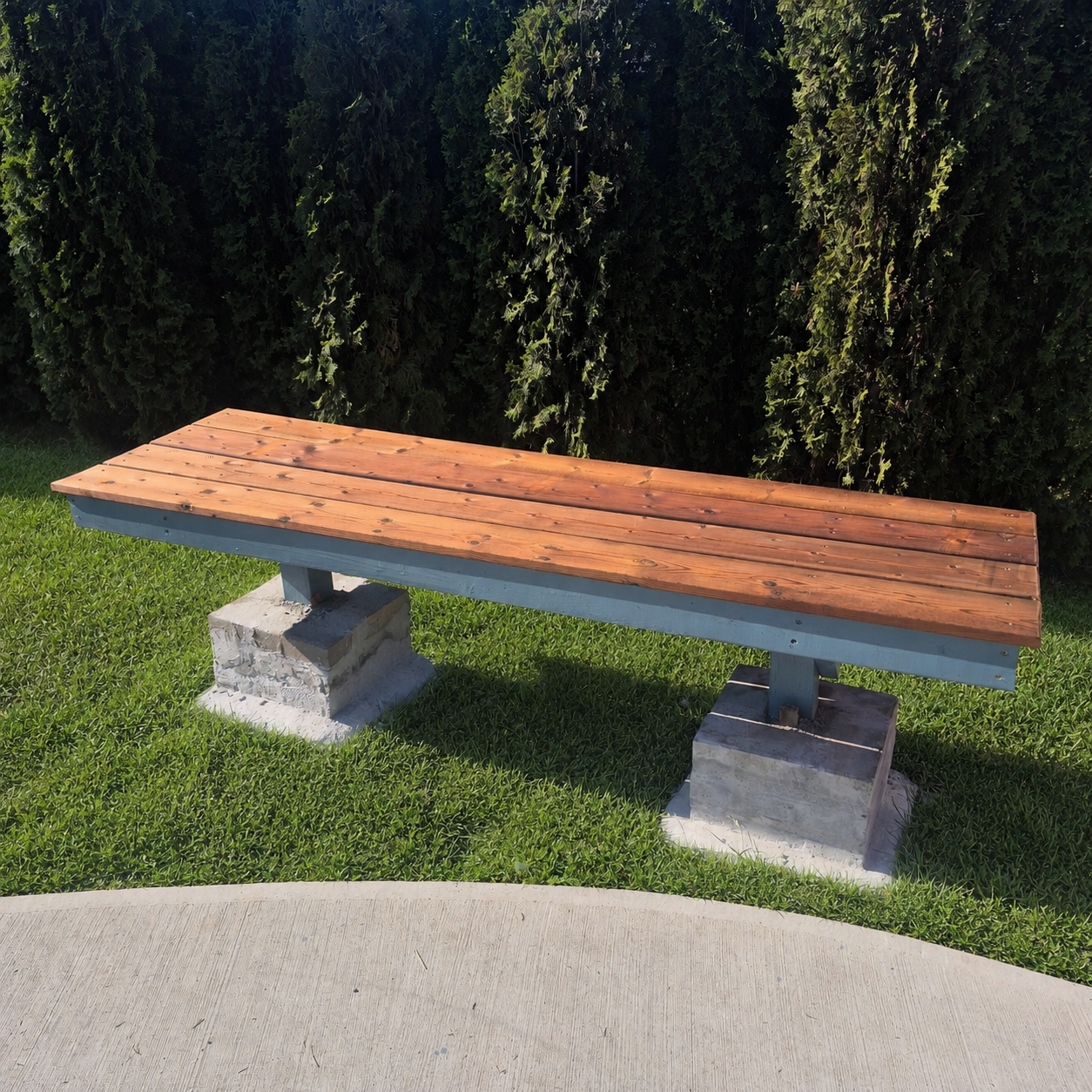 Blue Bench wooden community bench prototype with blue support frame built by Plane4 Grain