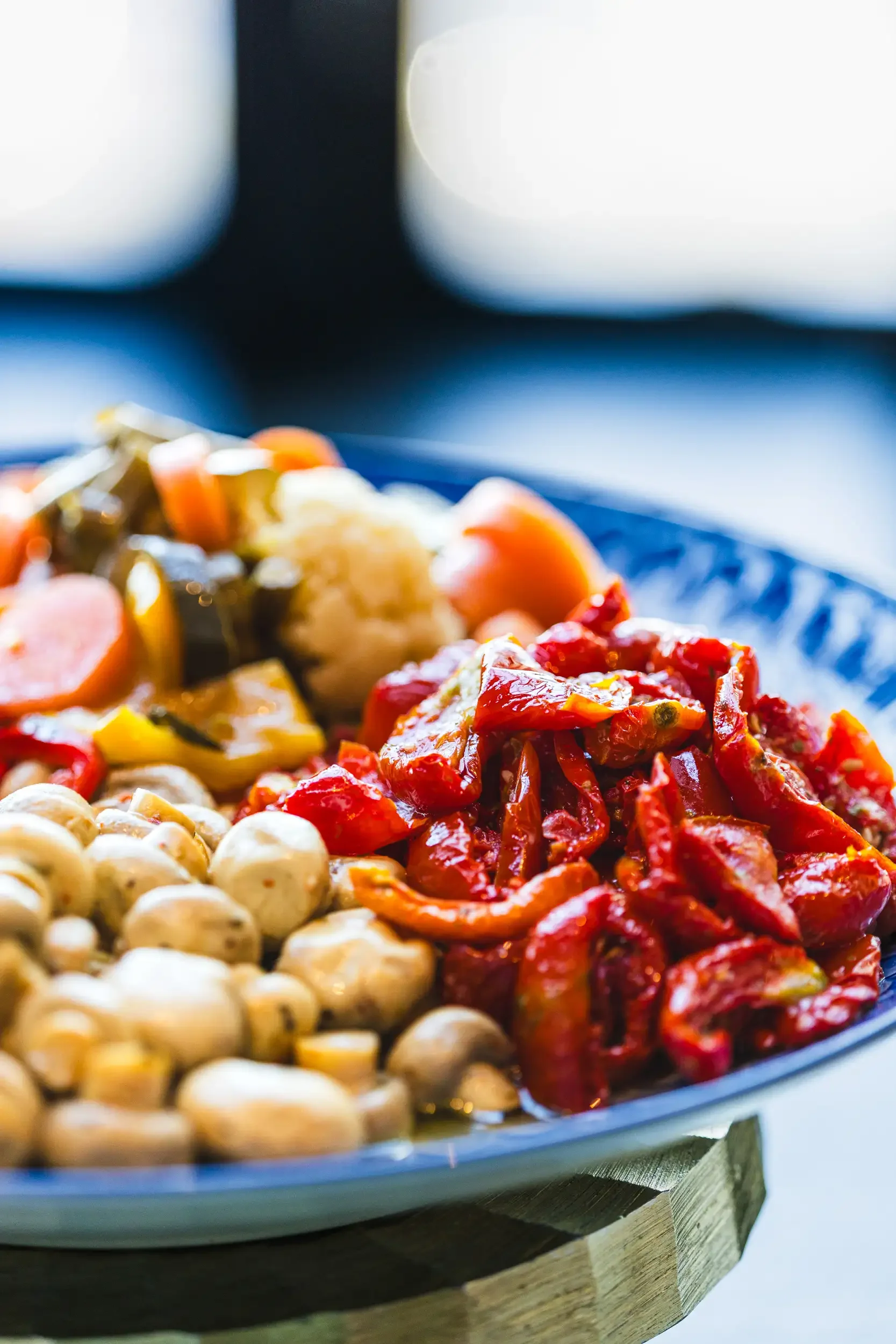 A colorful antipasto platter with vegetables and olives