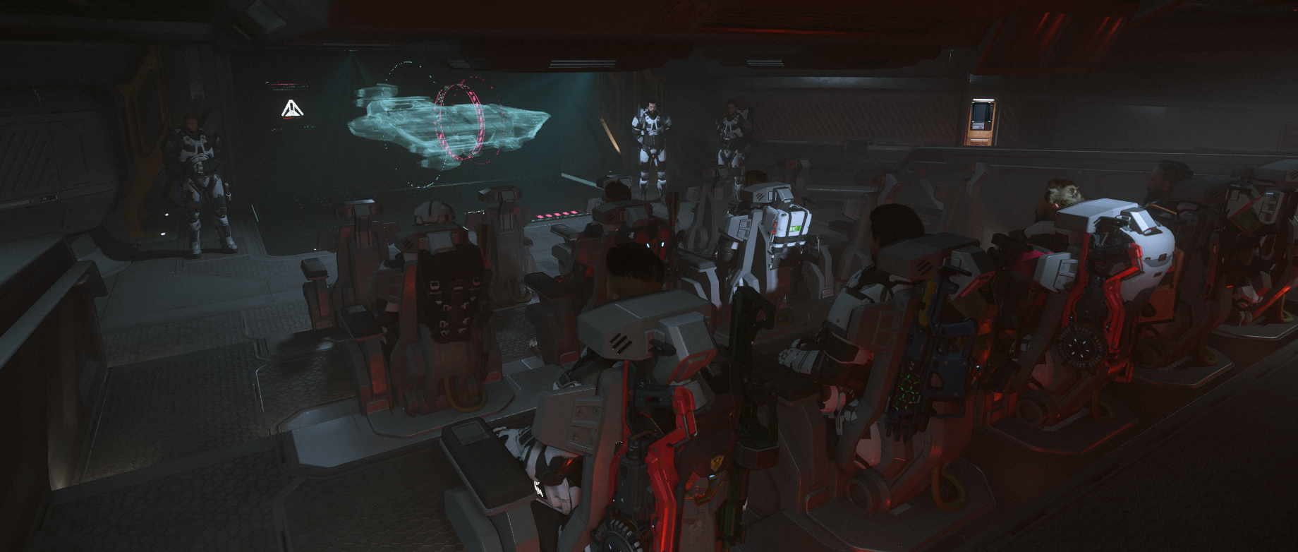 HDI personnel seated aboard a spacecraft