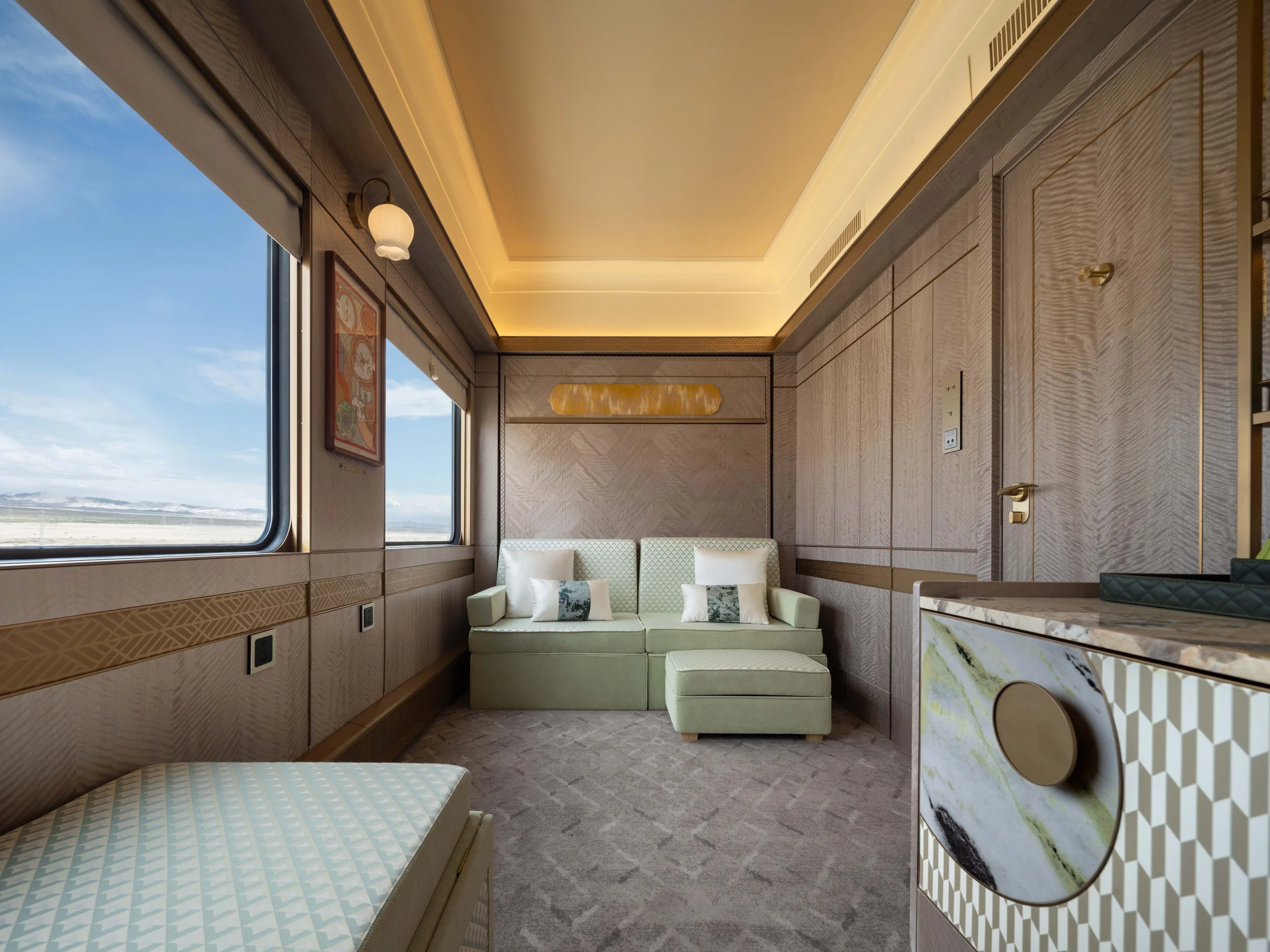 Family Deluxe Suite on the Silk Road Express in day-time mode with sofa