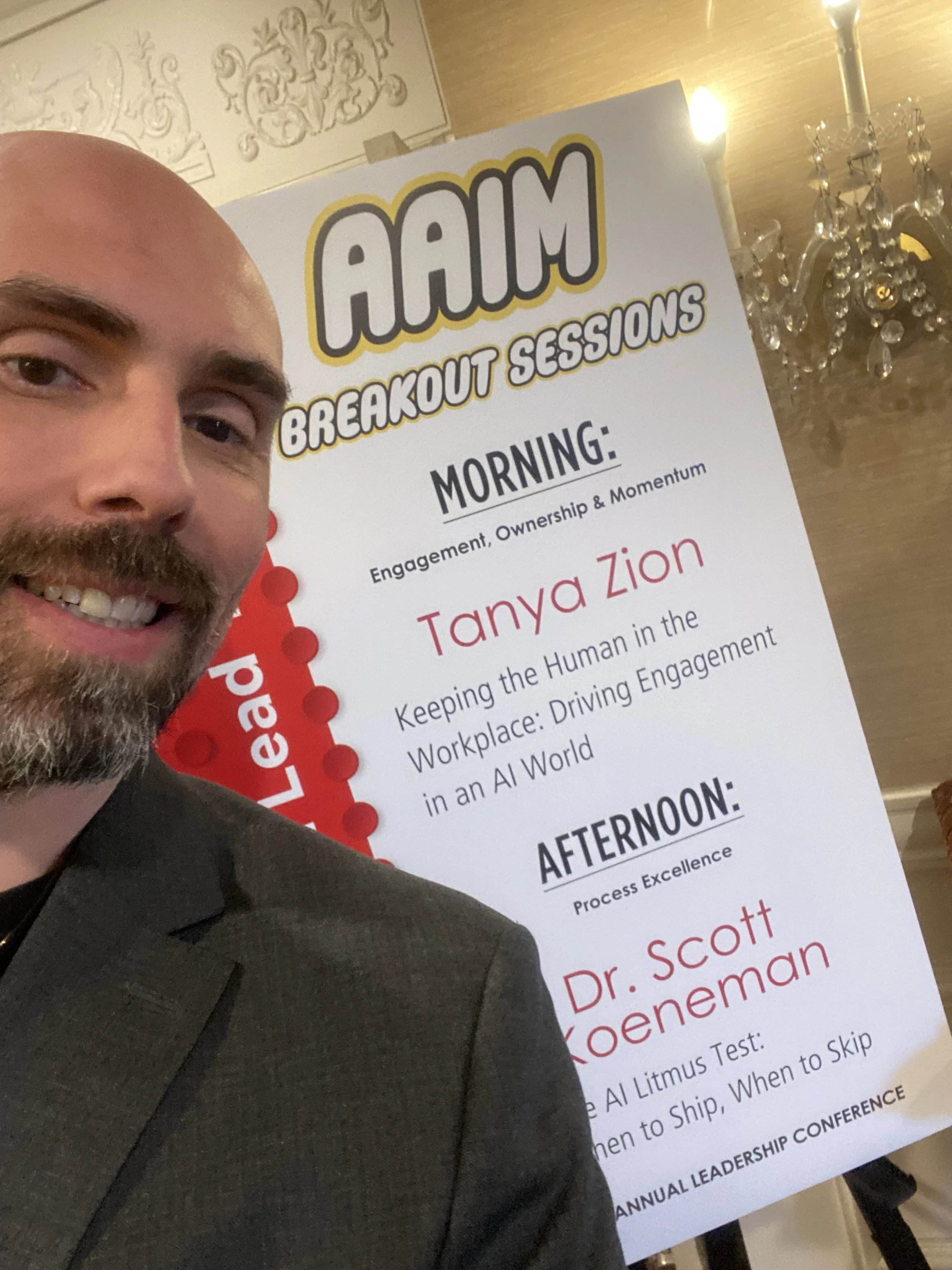 Dr. Scott Koeneman in front of AAIM breakout session sign