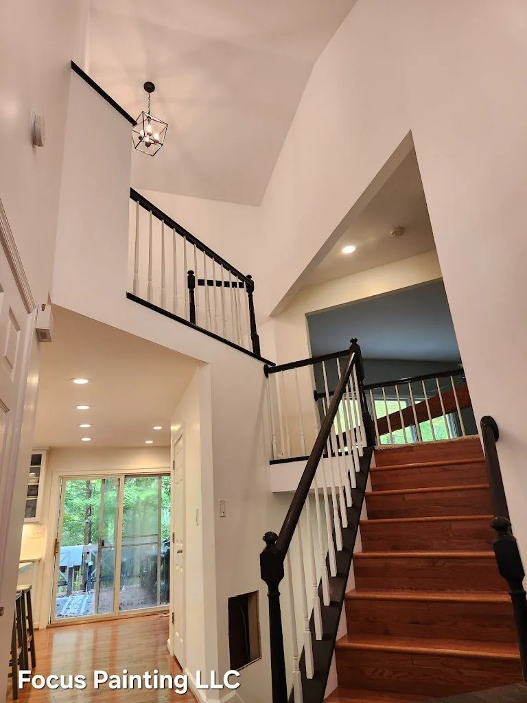 Interior foyer painting with walls and railings by Focus Painting in Maryland
