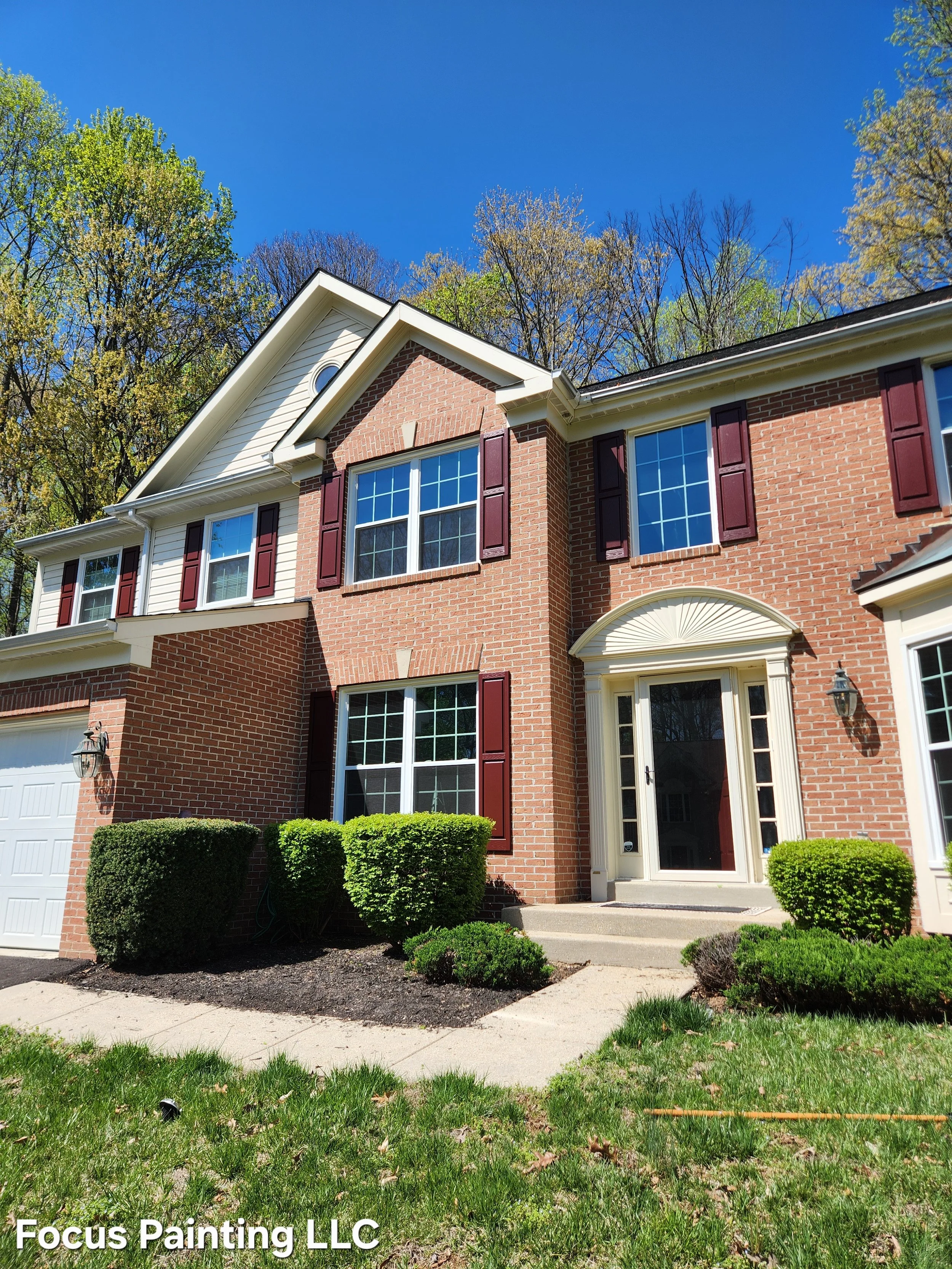 Red shutter exterior painting by Focus Painting in Maryland