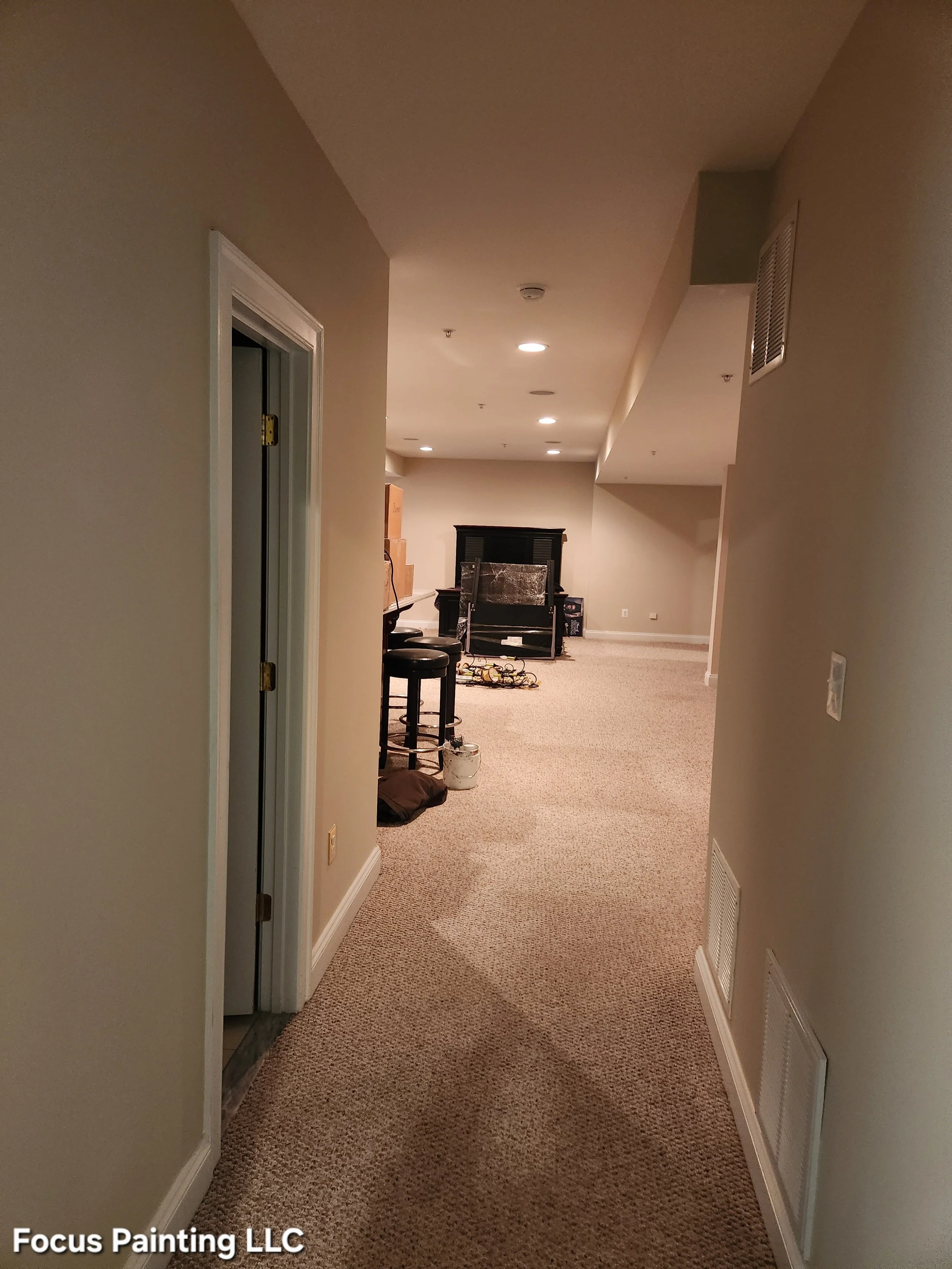 Finished basement with ceiling, walls, and trim painted by Focus Painting in Maryland