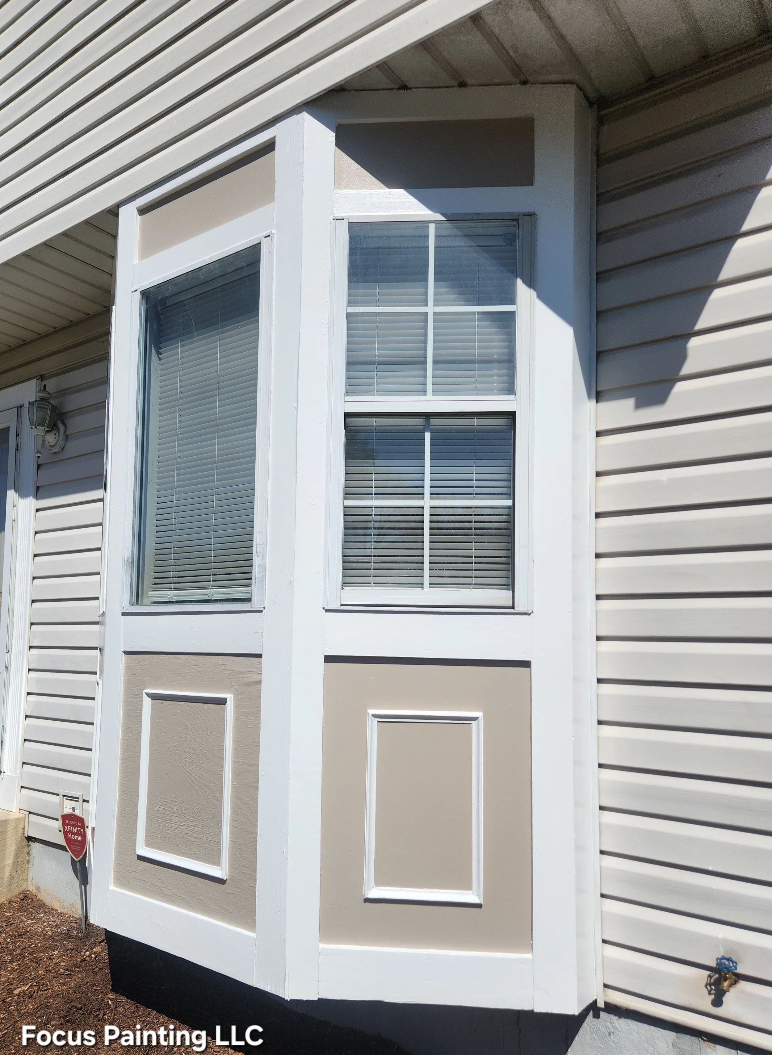 Exterior bay window wood repair and painting by Focus Painting in Maryland