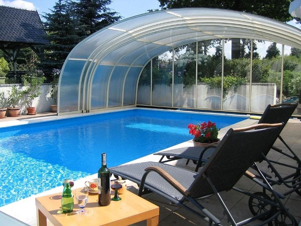 Laguna pool enclosure set up for entertaining in a backyard