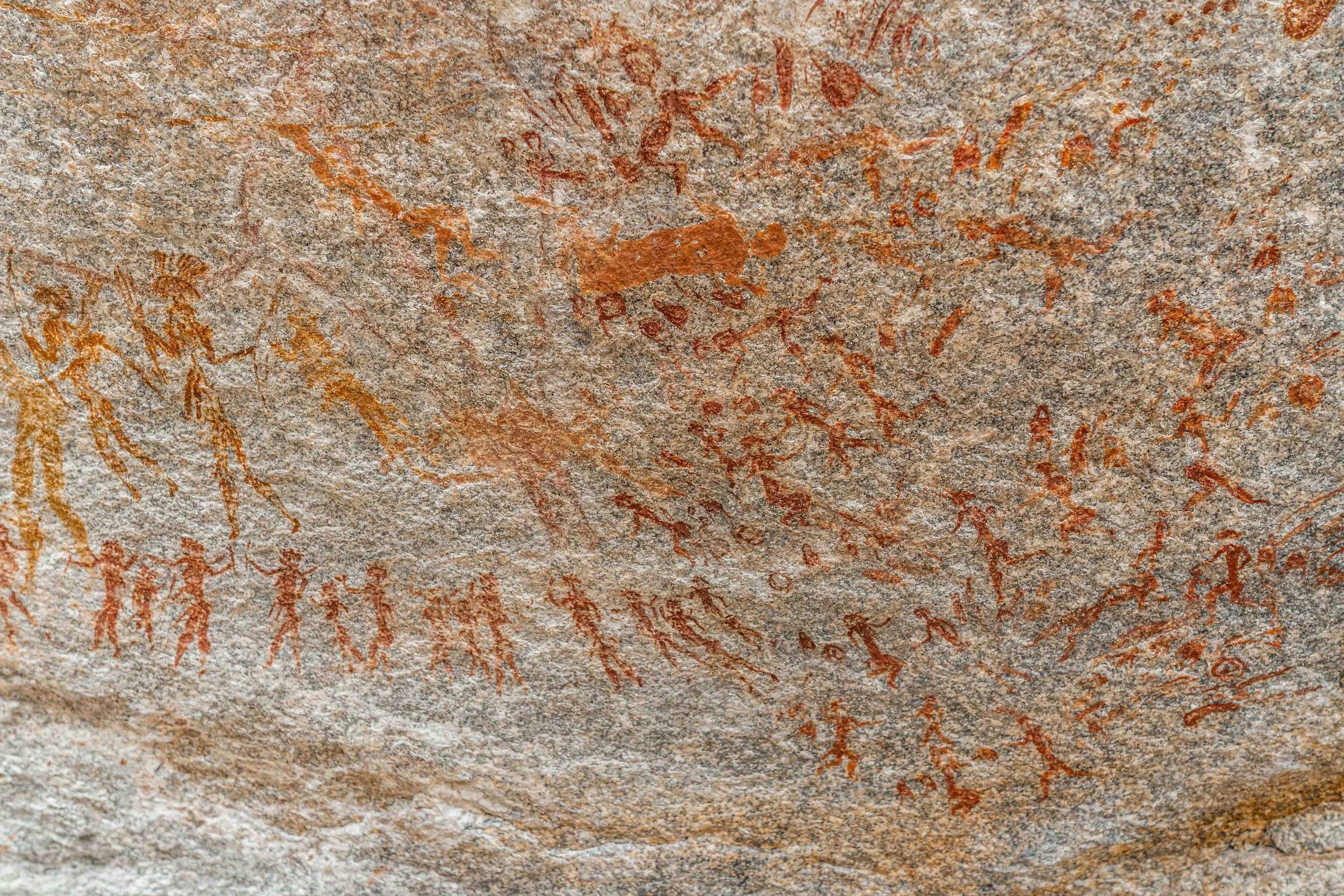 Elongated human figures