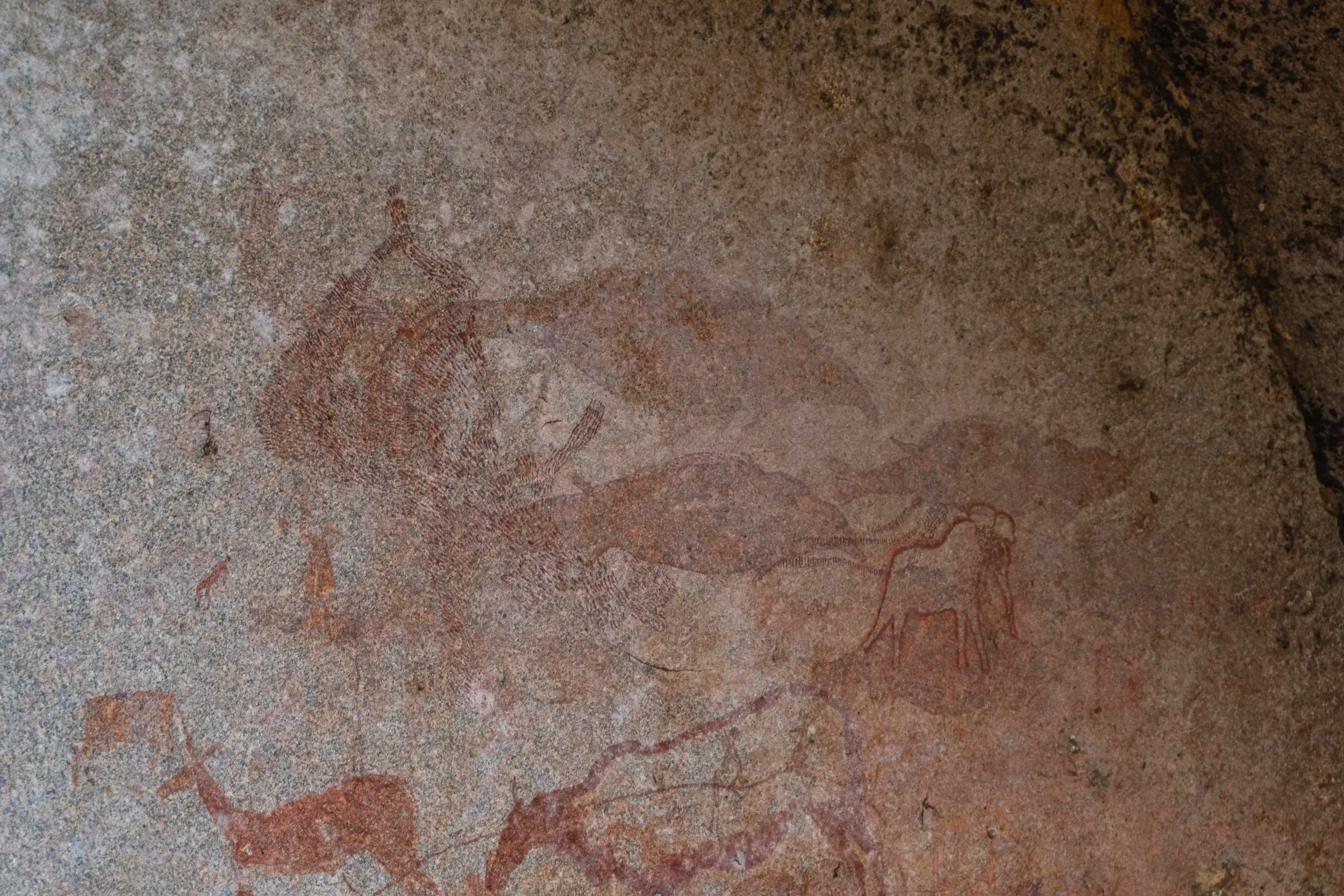 Elongated human figures