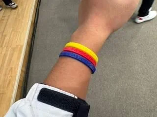 Commemorative wristbands gifted by the choir — a colorful token of our new friendship.