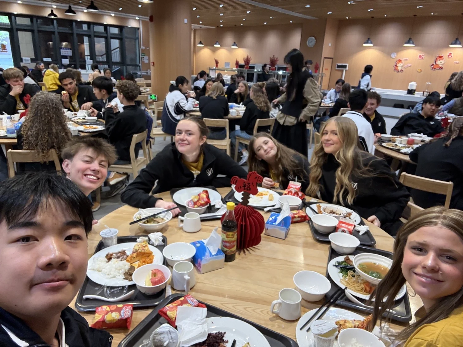 Sharing meals and stories in the Shenzhen Middle School student dining hall.