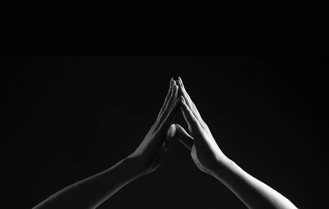 Hands pressed together in stillness
