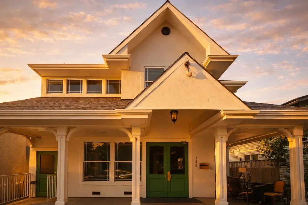 The front of Aracely Lounge, a house with a covered porch on East Prospect Avenue in Danville