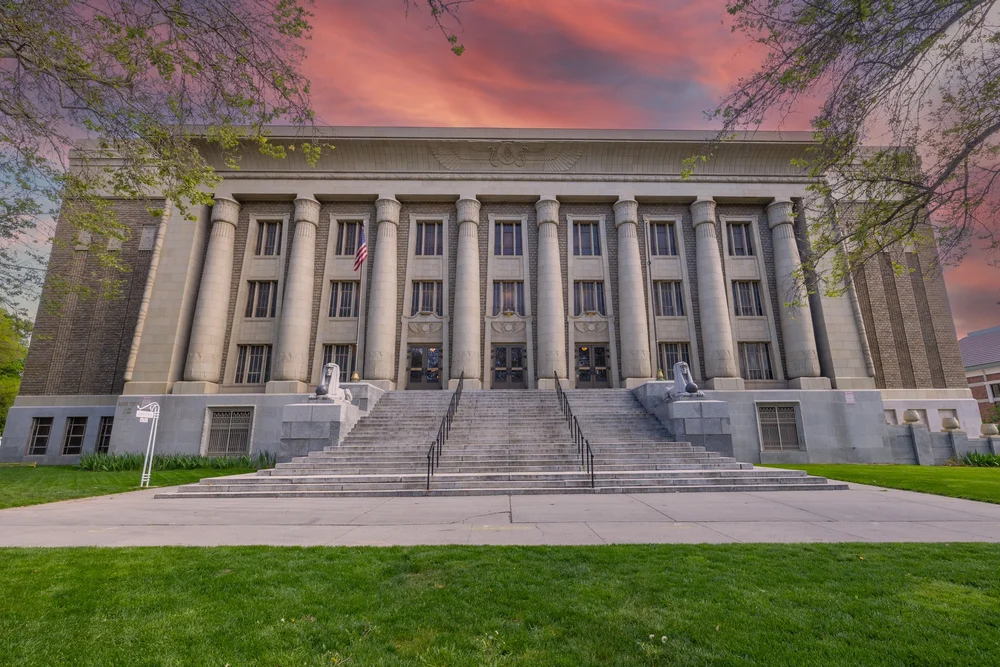 The Masonic Temple facade and front steps beneath a pink evening sky