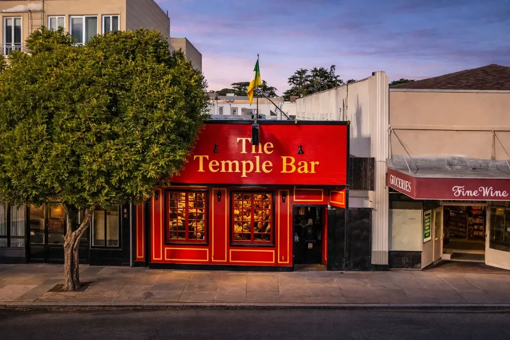 The red front of The Temple Bar on a street in the Inner Sunset