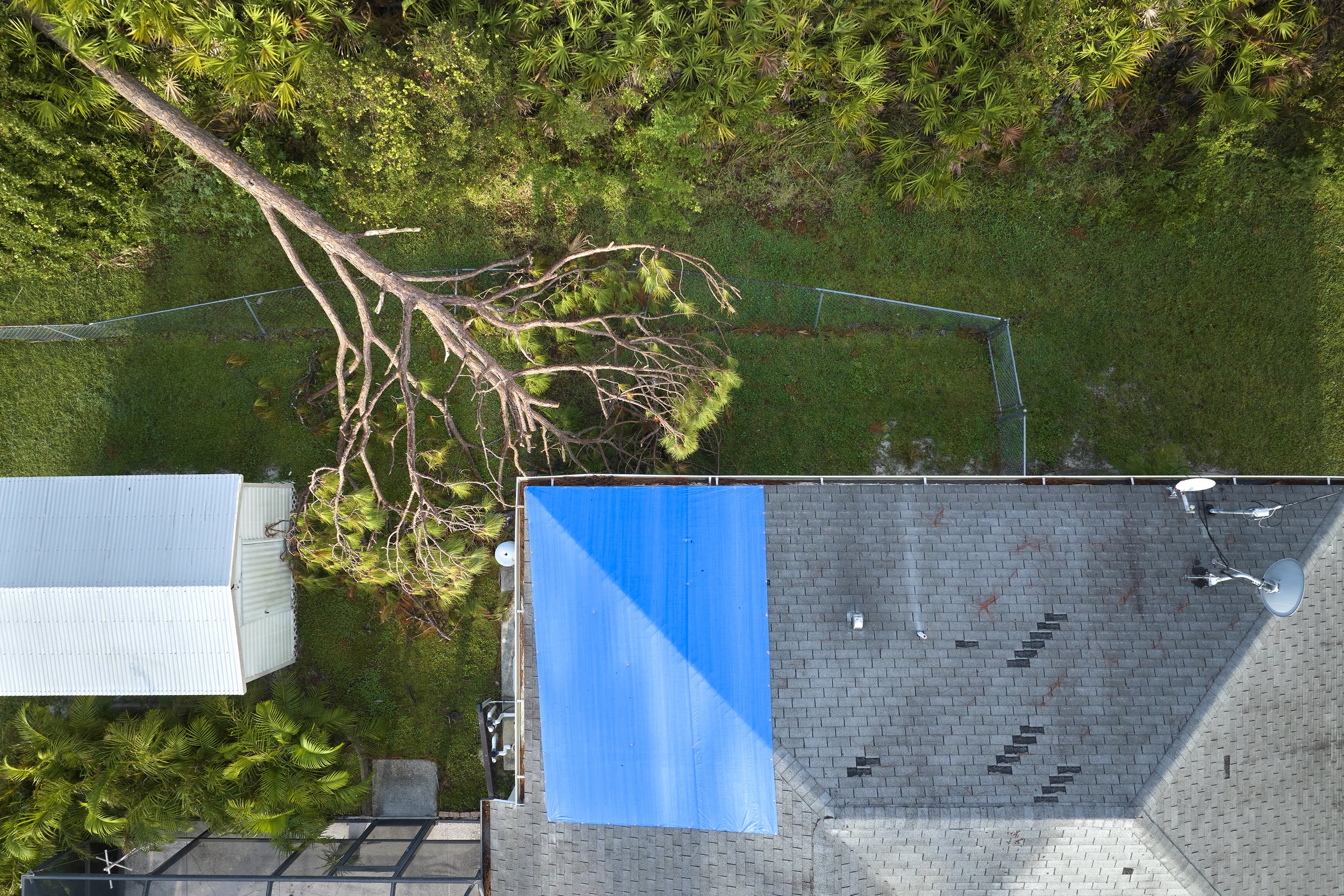 Emergency roof tarping installed on a tile roof after storm damage in Scottsdale, Arizona