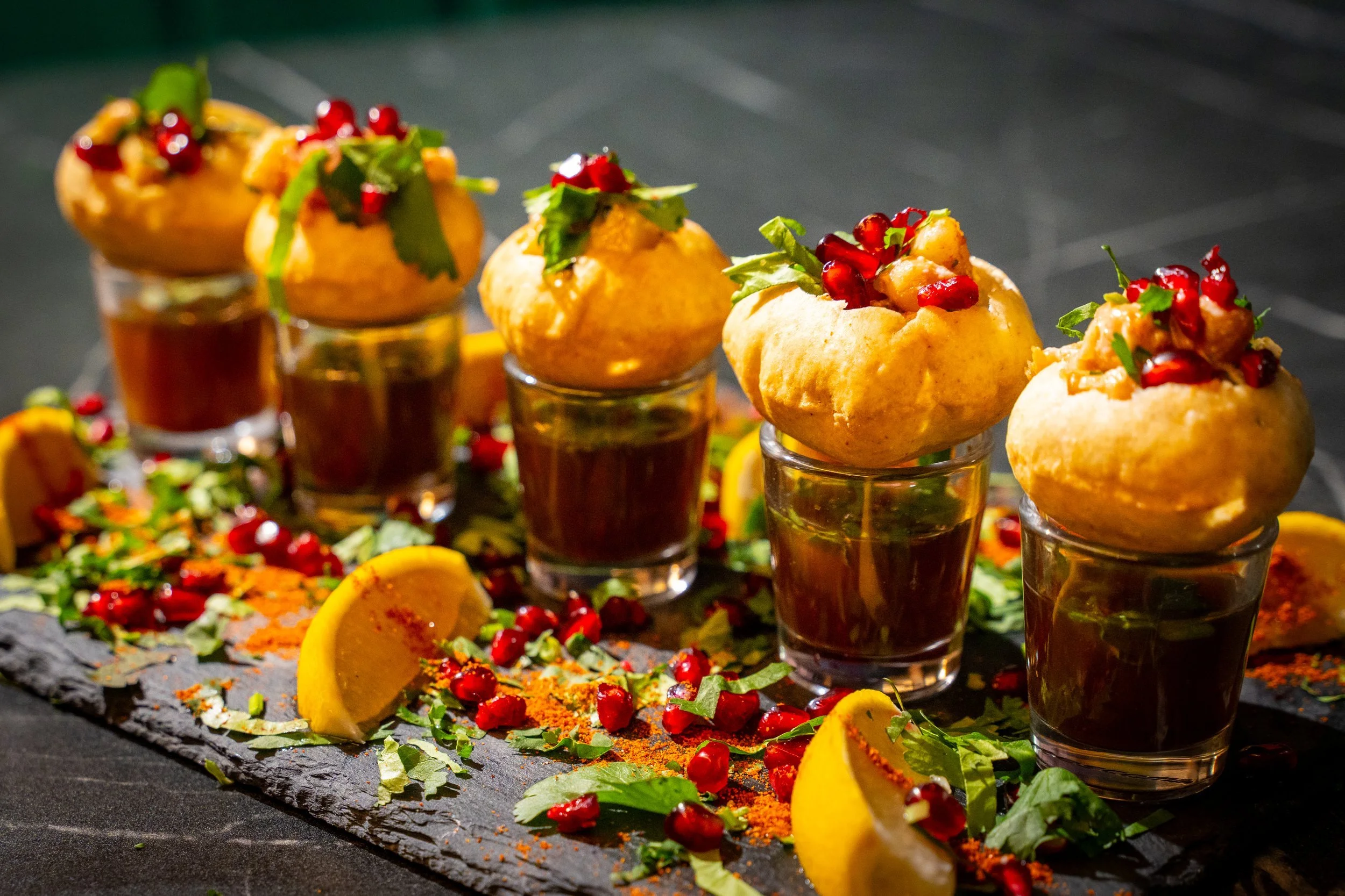 Chaat canapés served with accompanying glasses
