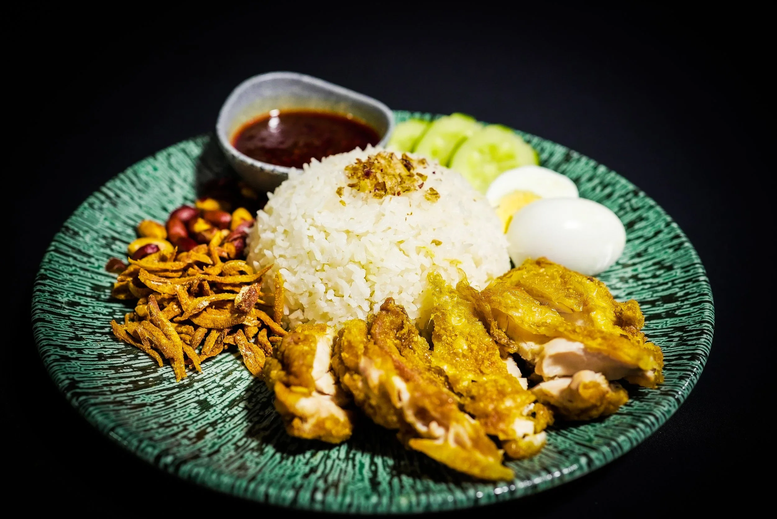 Nasi lemak with chicken, coconut rice, egg, sambal and accompaniments from The Malay Courtyard