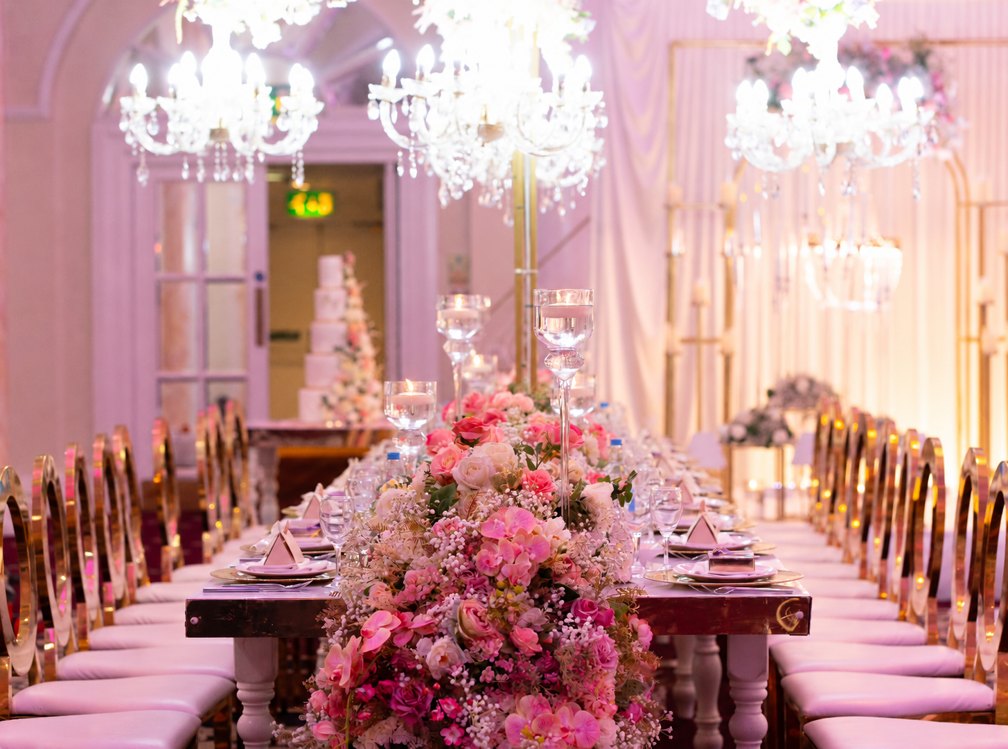 Pink floral runner along a long reception table