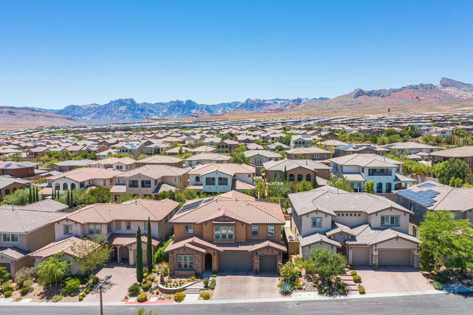 Aerial view of Summerlin West homes in Las Vegas with the Red Rock Canyon escarpment in the background