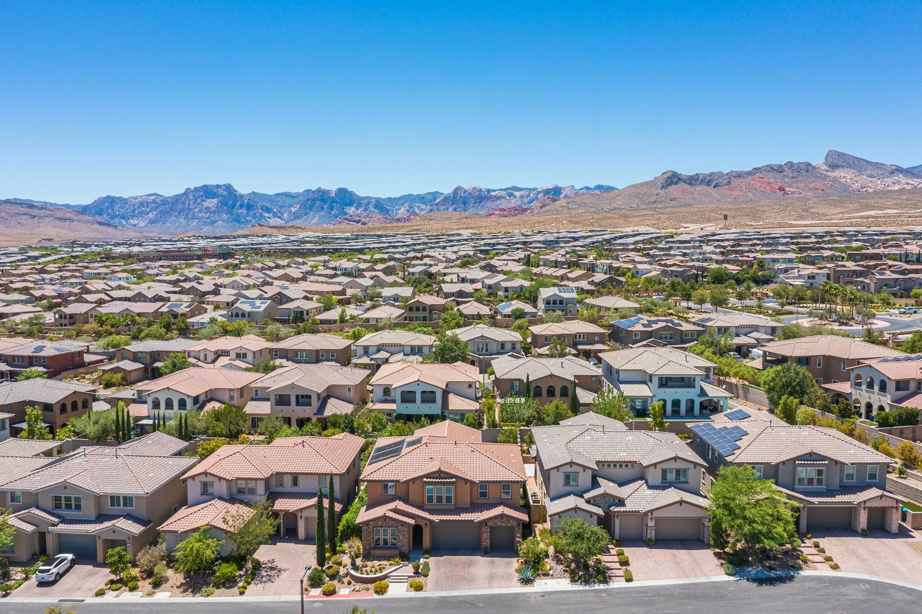 Red Rock Canyon rising behind the Summerlin West landscape in Las Vegas